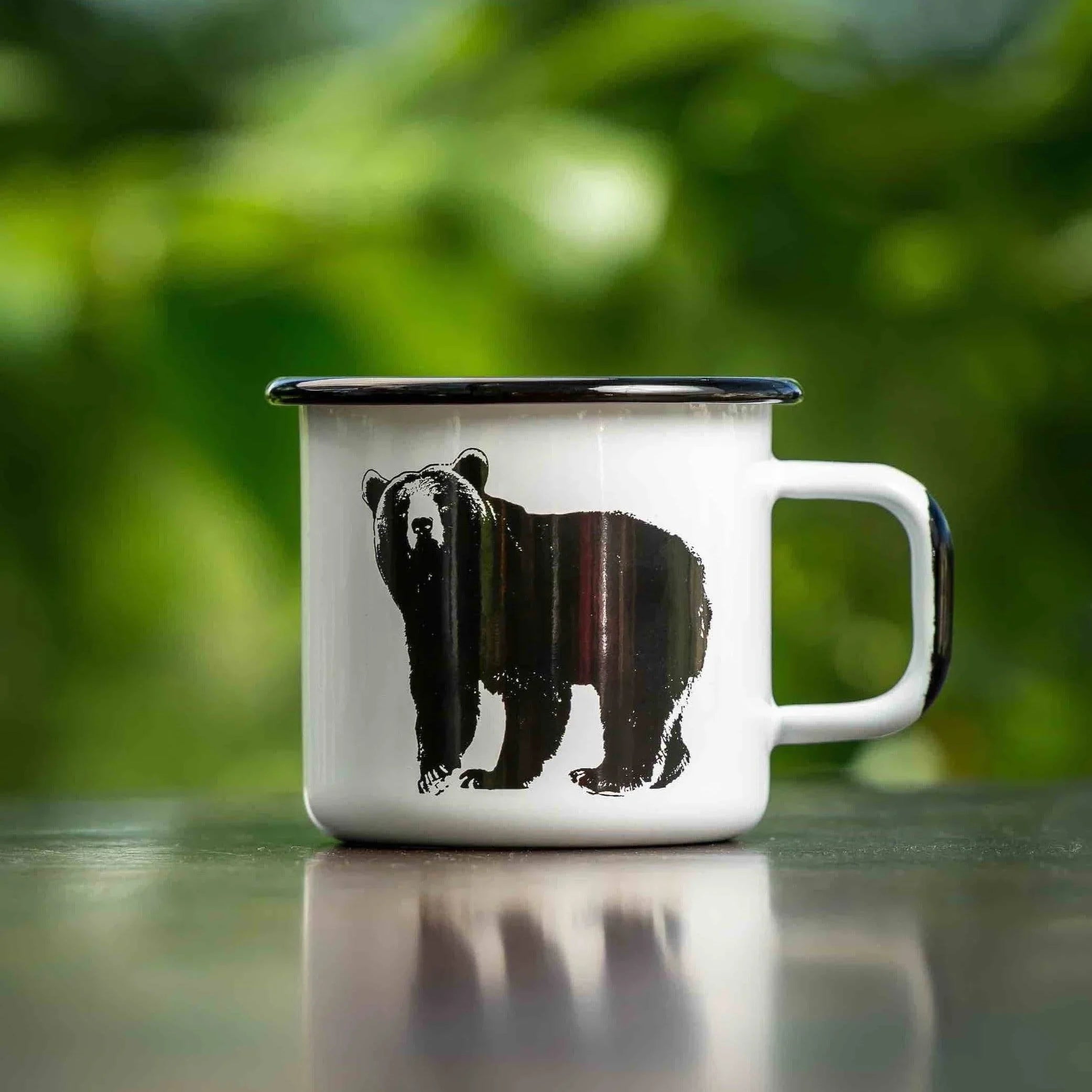 Bearhug enamel mug white metal with black bear illustration and black rim outdoors