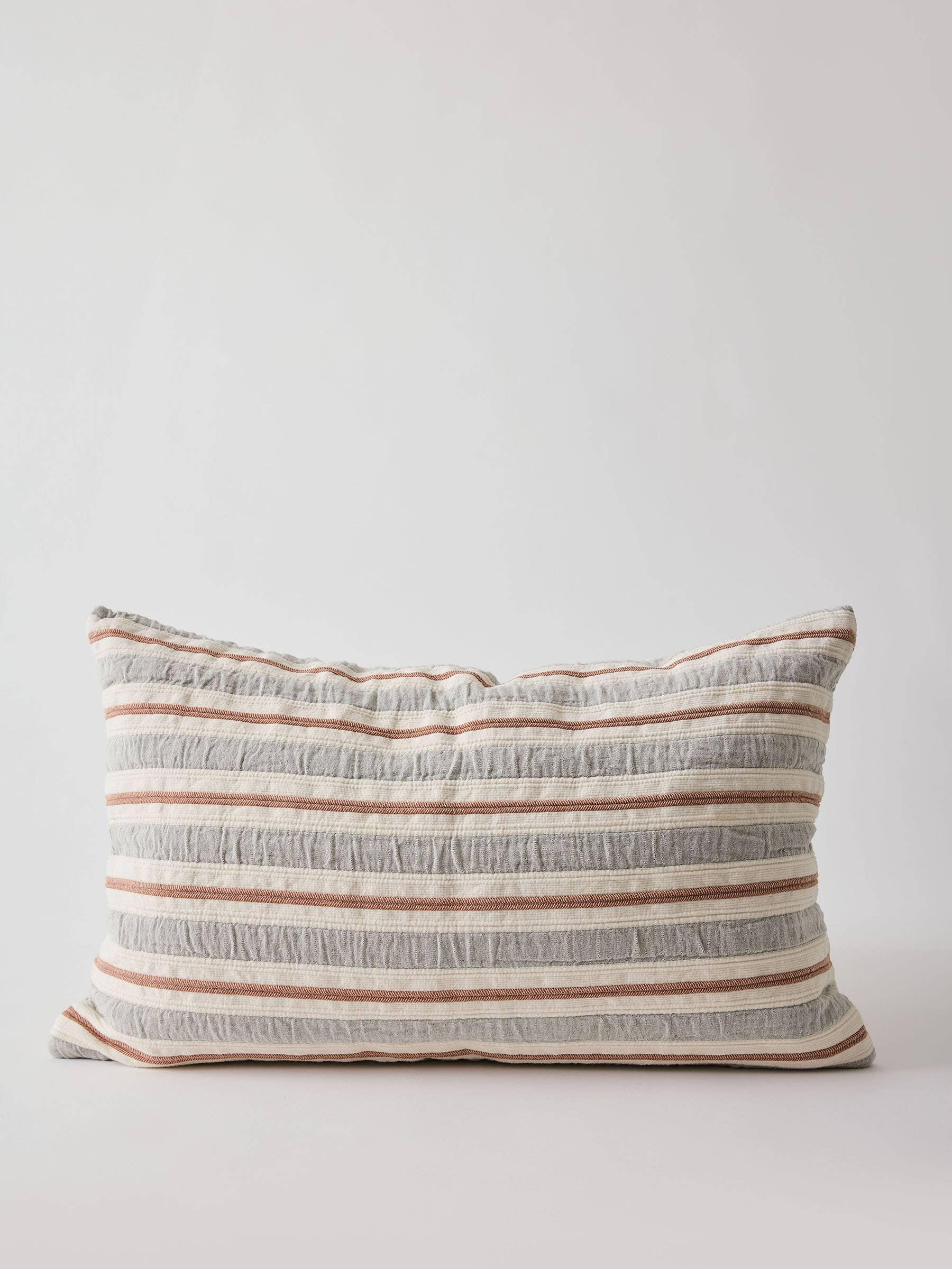 Walter G striped linen cushion in grey, white and rust on white background