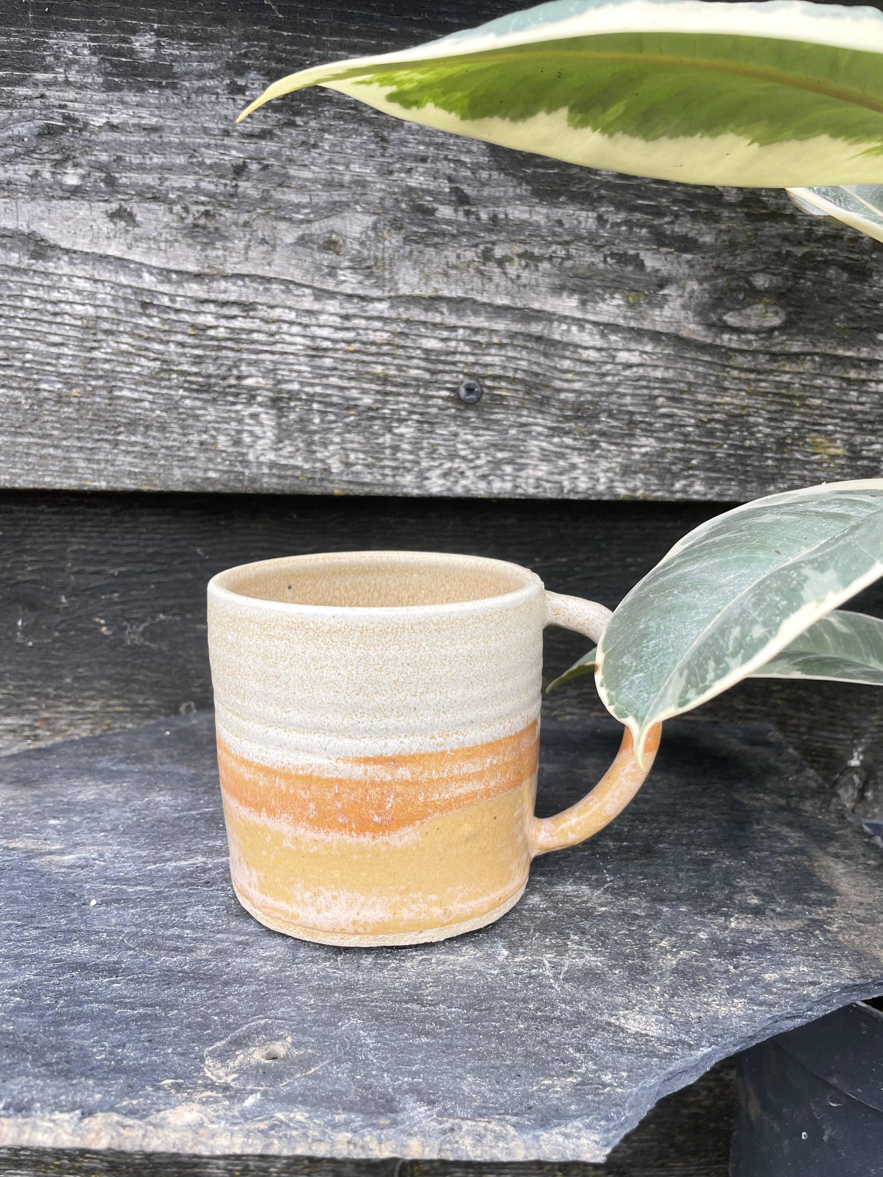 Studio Foley ceramic mug, two-tone sand and ochre stoneware, outdoors on slate