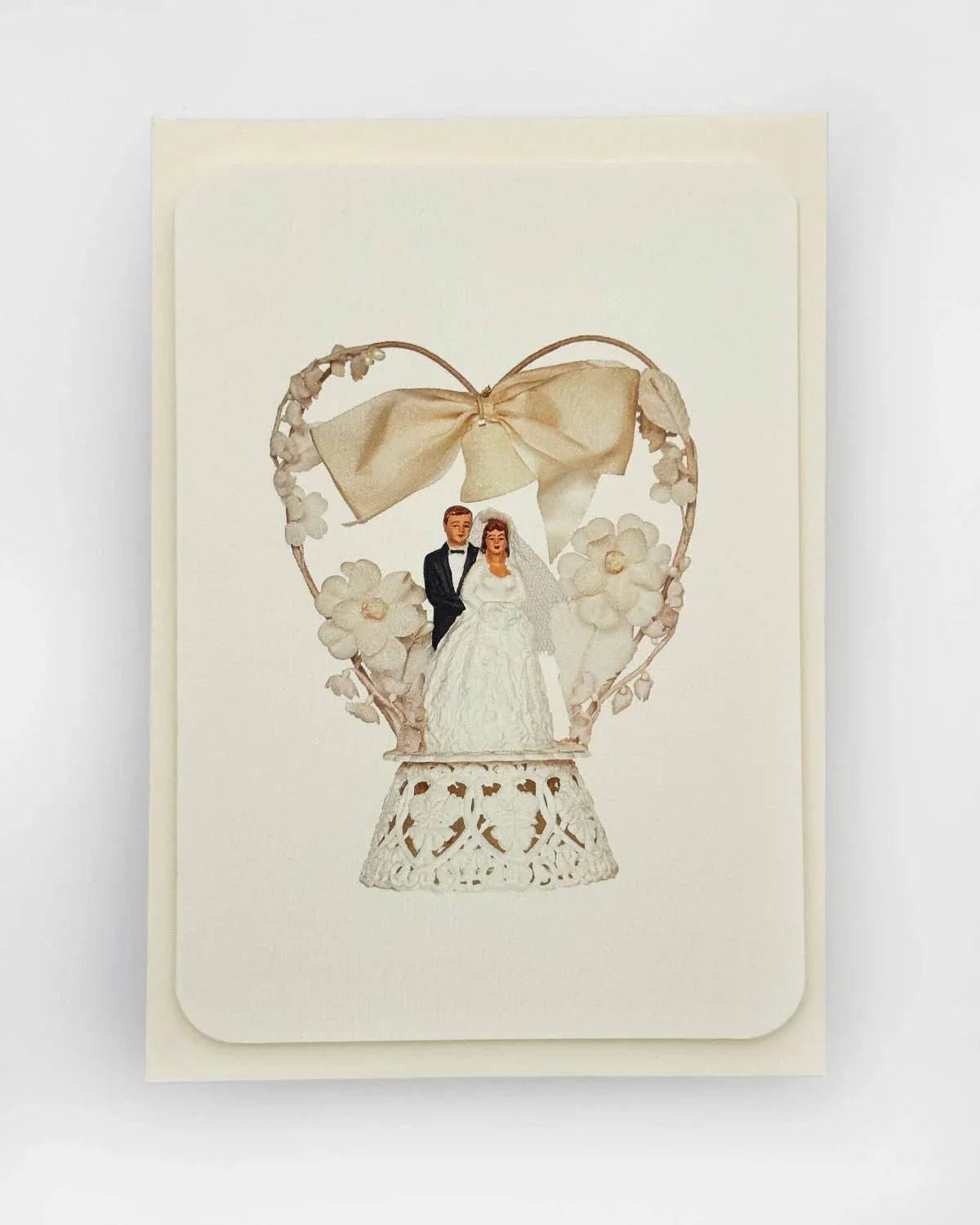 Red Cap Cards premium wedding card with lace, floral paper details, and beige bow accents