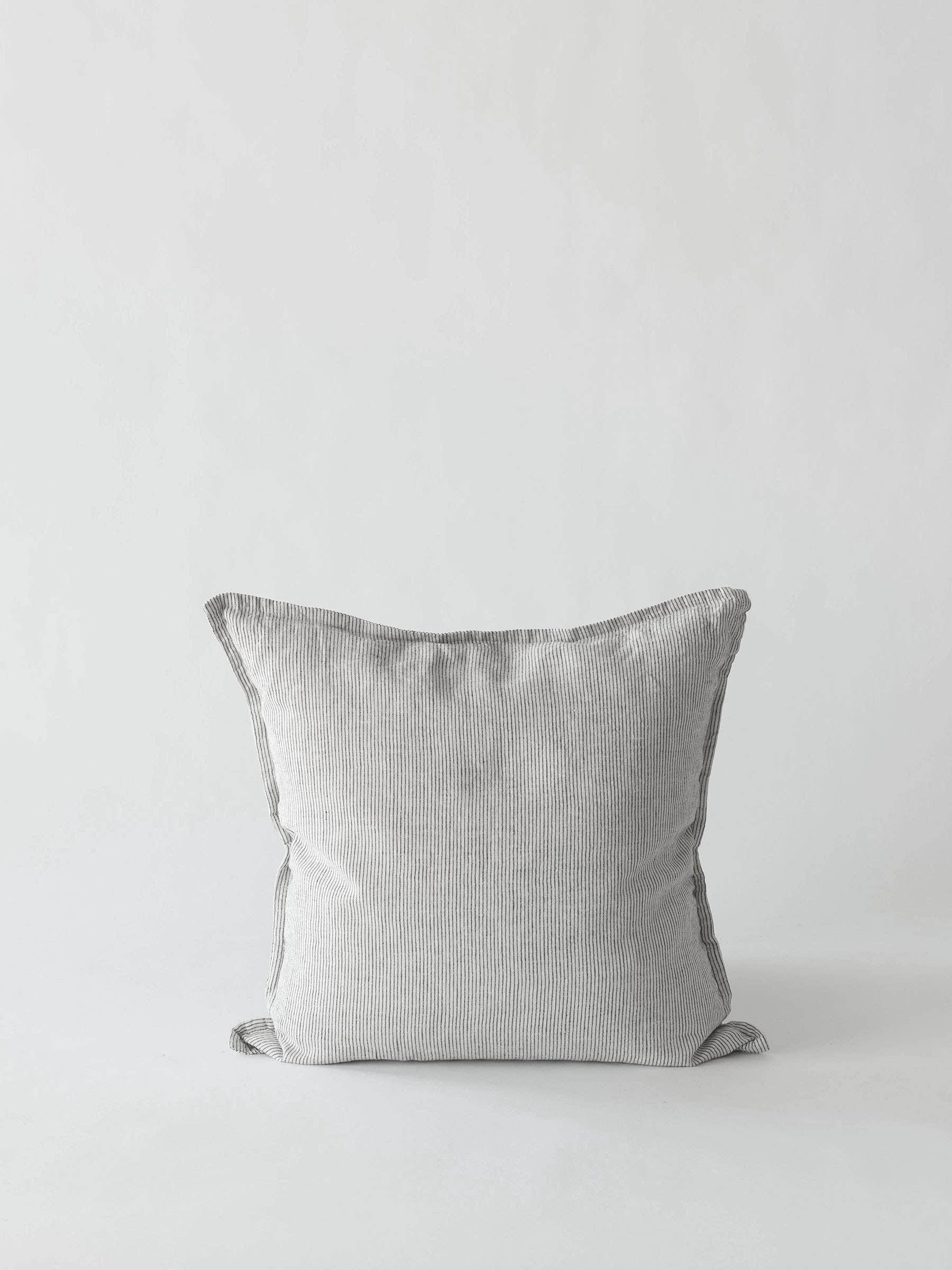 Zara Home striped cotton cushion cover in light grey on a minimalist white background