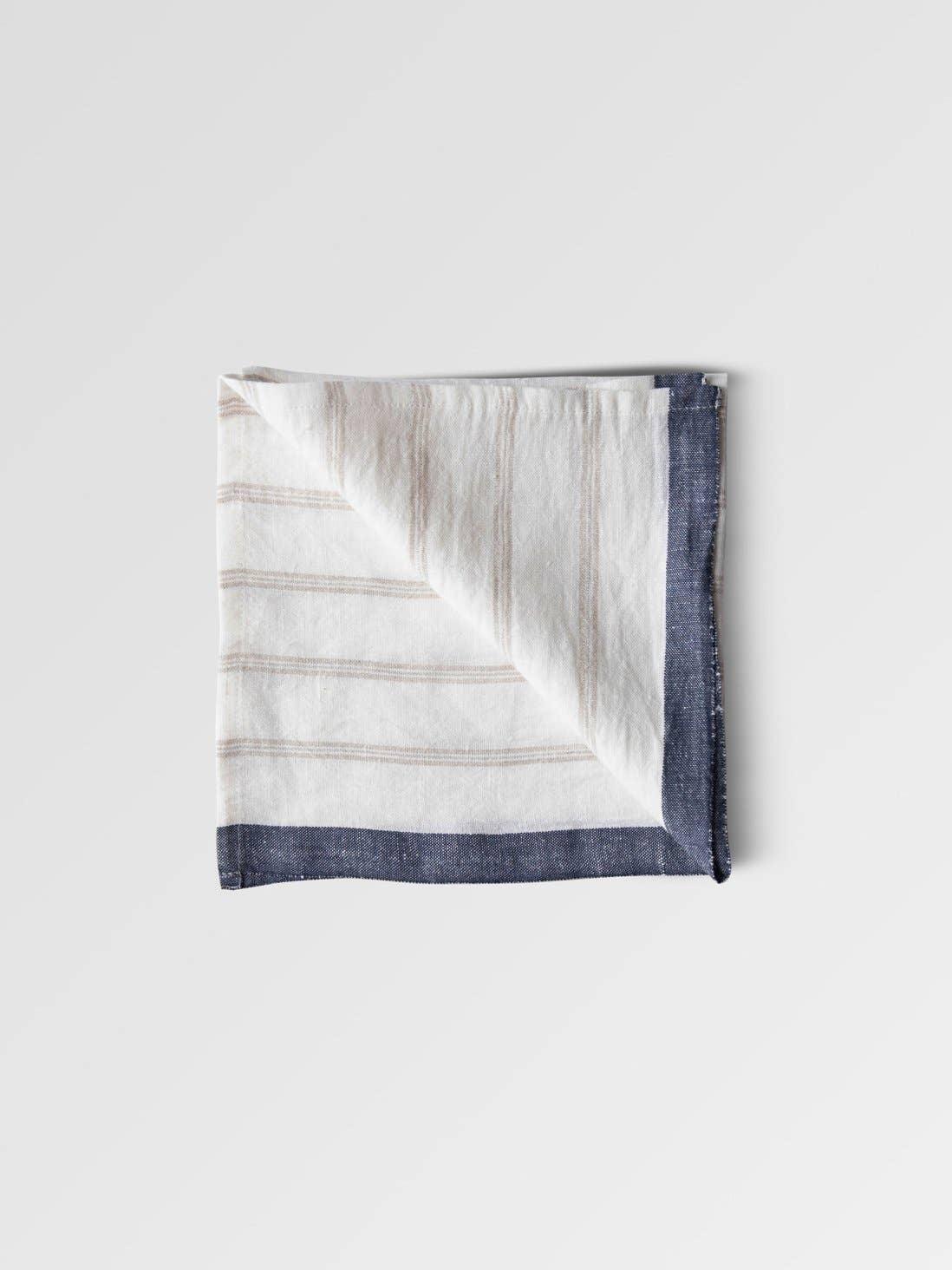 TOUJOURS linen napkin, white with beige stripes and navy border, premium textile
