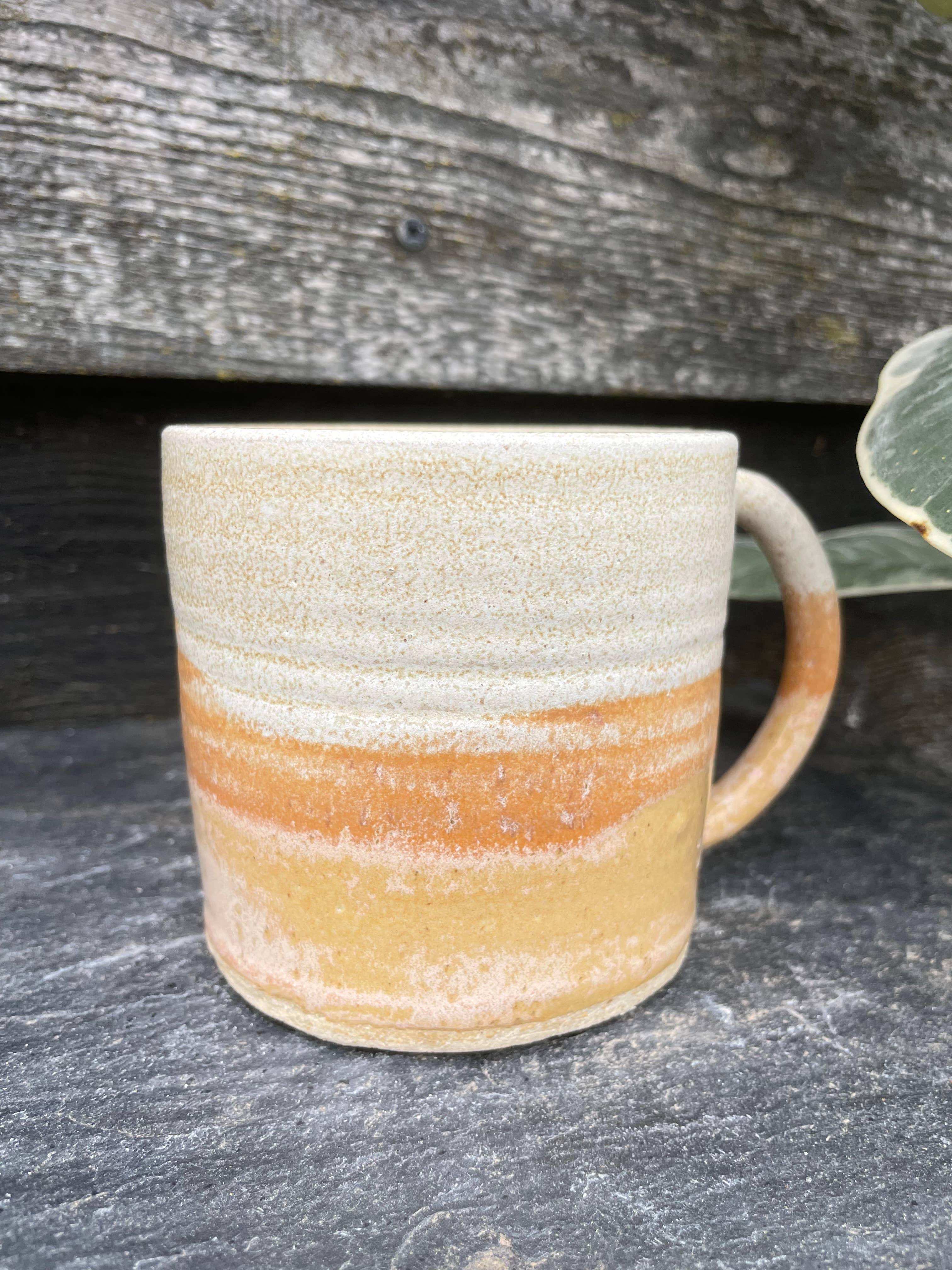 Clai Studio ceramic mug in tan and cream stoneware, rustic handmade pottery cup