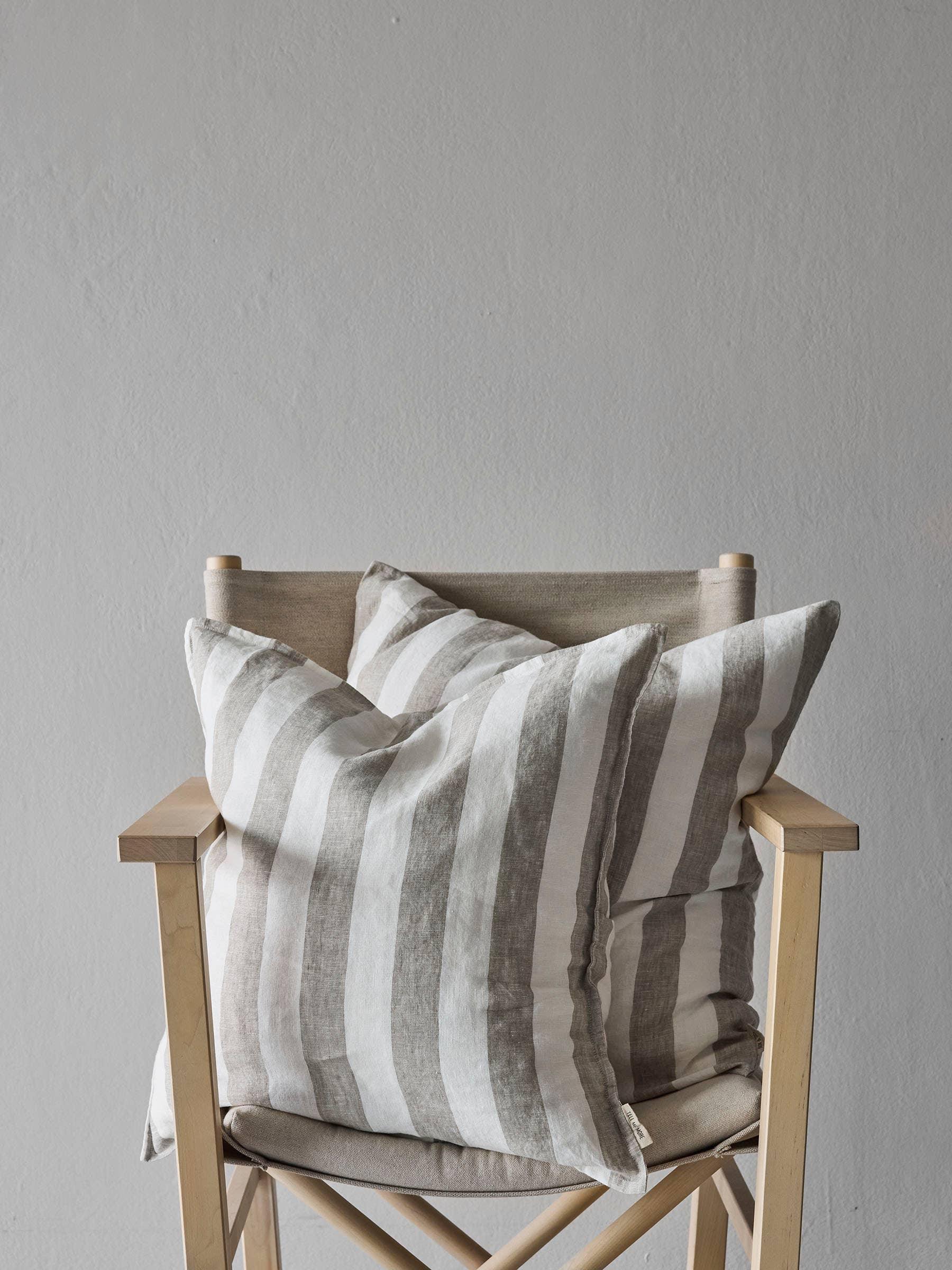 Linge Particulier linen striped cushion covers in natural beige and white on wooden chair
