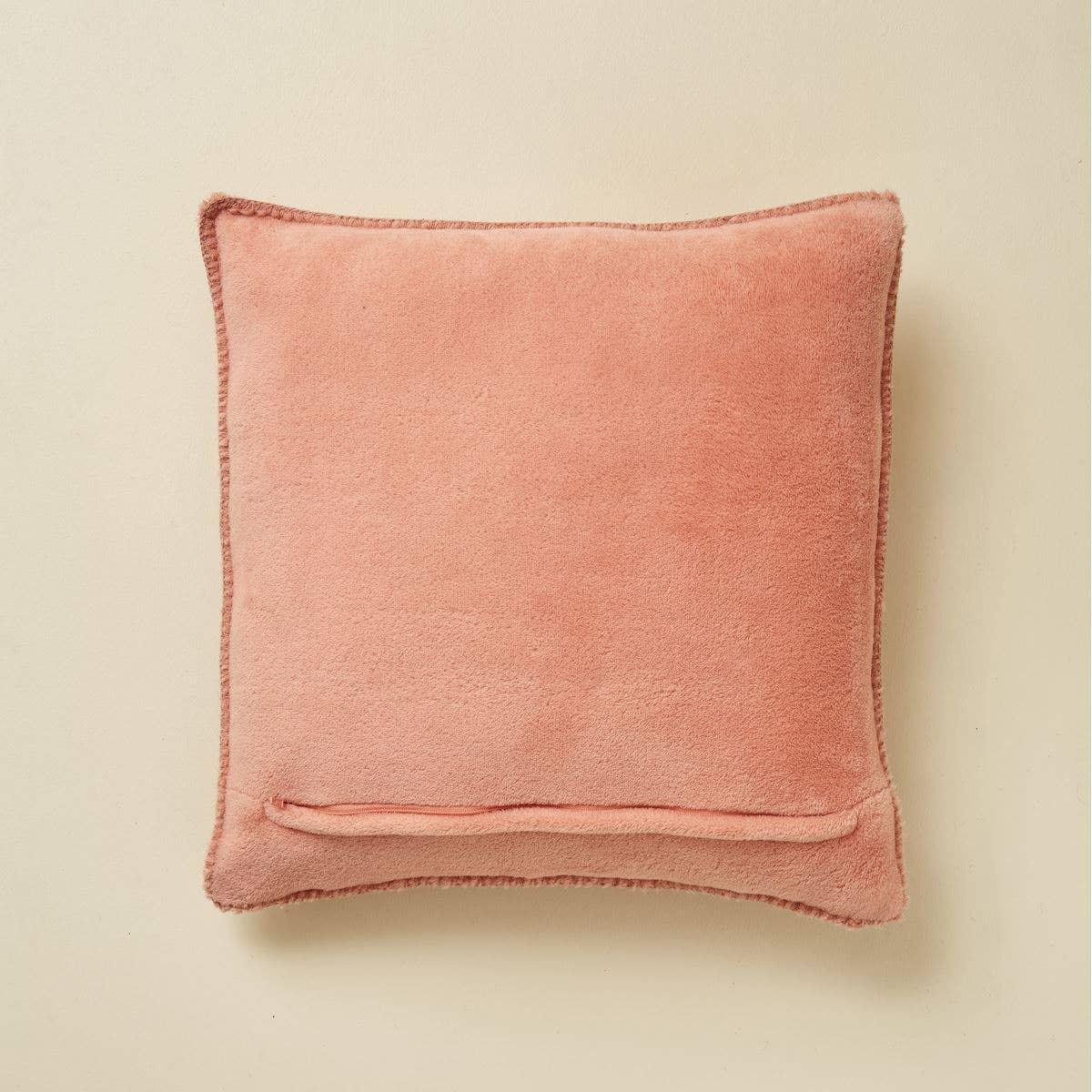 Casa Amarosa pink velvet throw pillow with stitched edges on cream background