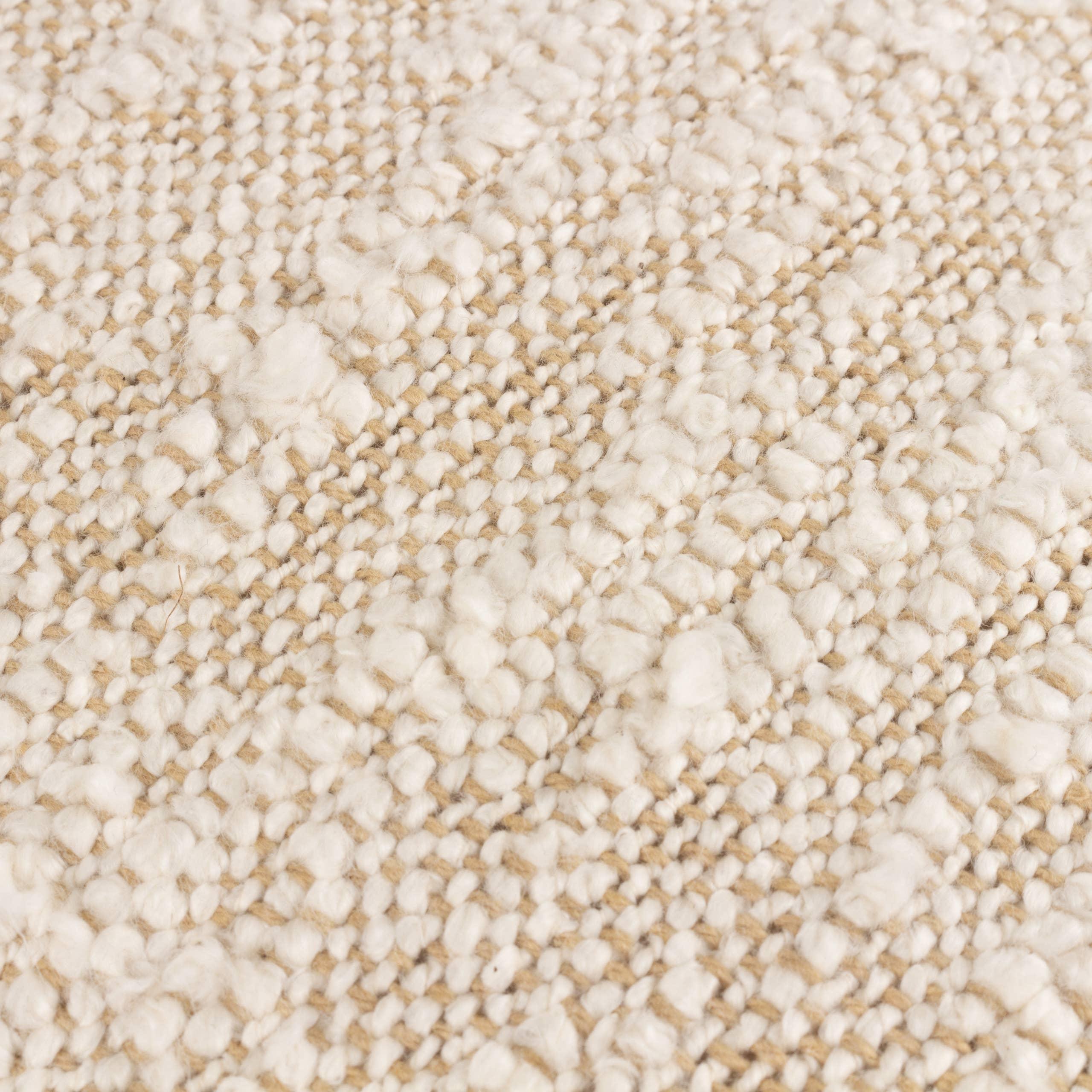 Wool and jute woven rug in cream by BAYA, close-up of textured premium carpet