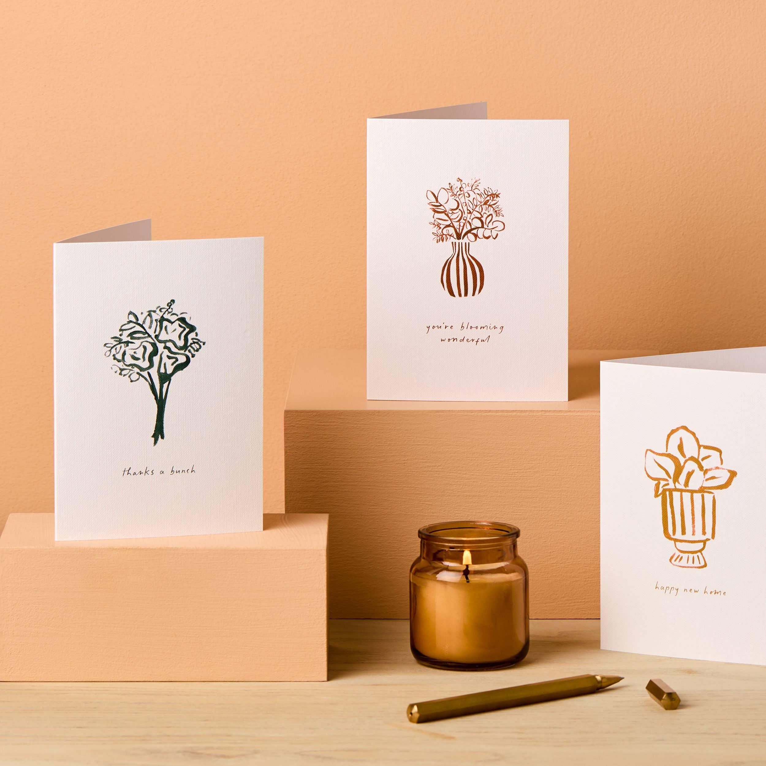 Papier greeting cards with floral illustrations, premium textured cardstock, cream and gold tones