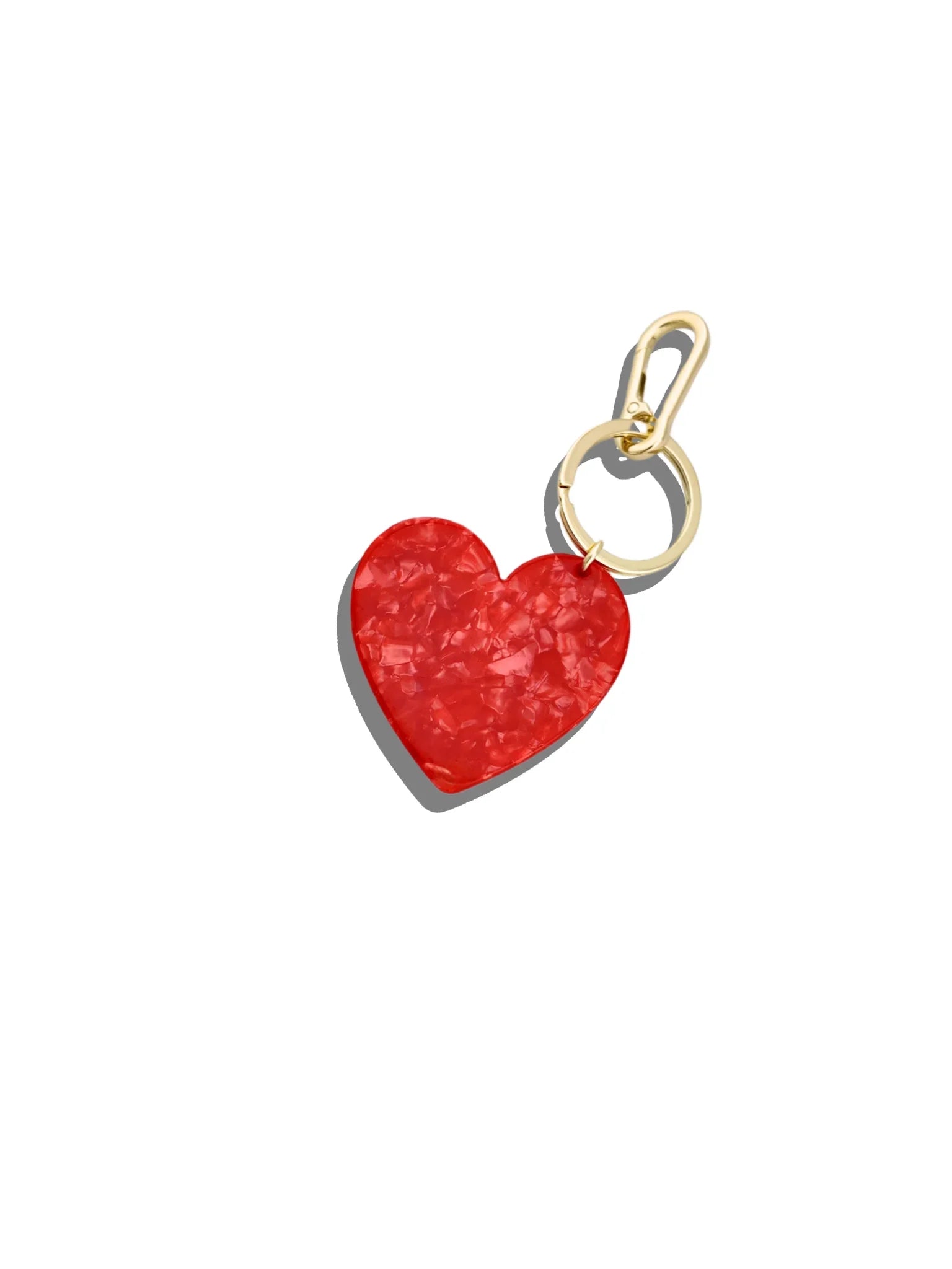 Lele Sadoughi red acetate heart charm with gold-tone metal hardware on white background