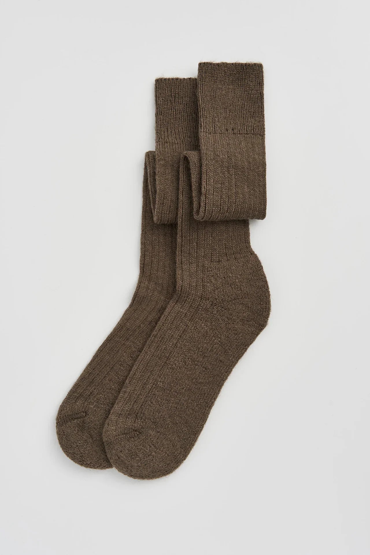 Auralee ribbed brown wool socks, premium knitwear accessory on white background