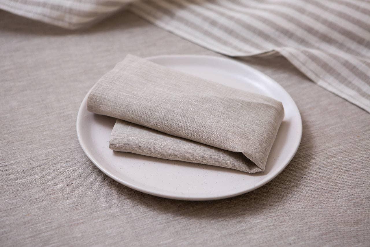 MagicLinen beige linen napkin on ceramic plate, premium natural table linen decor