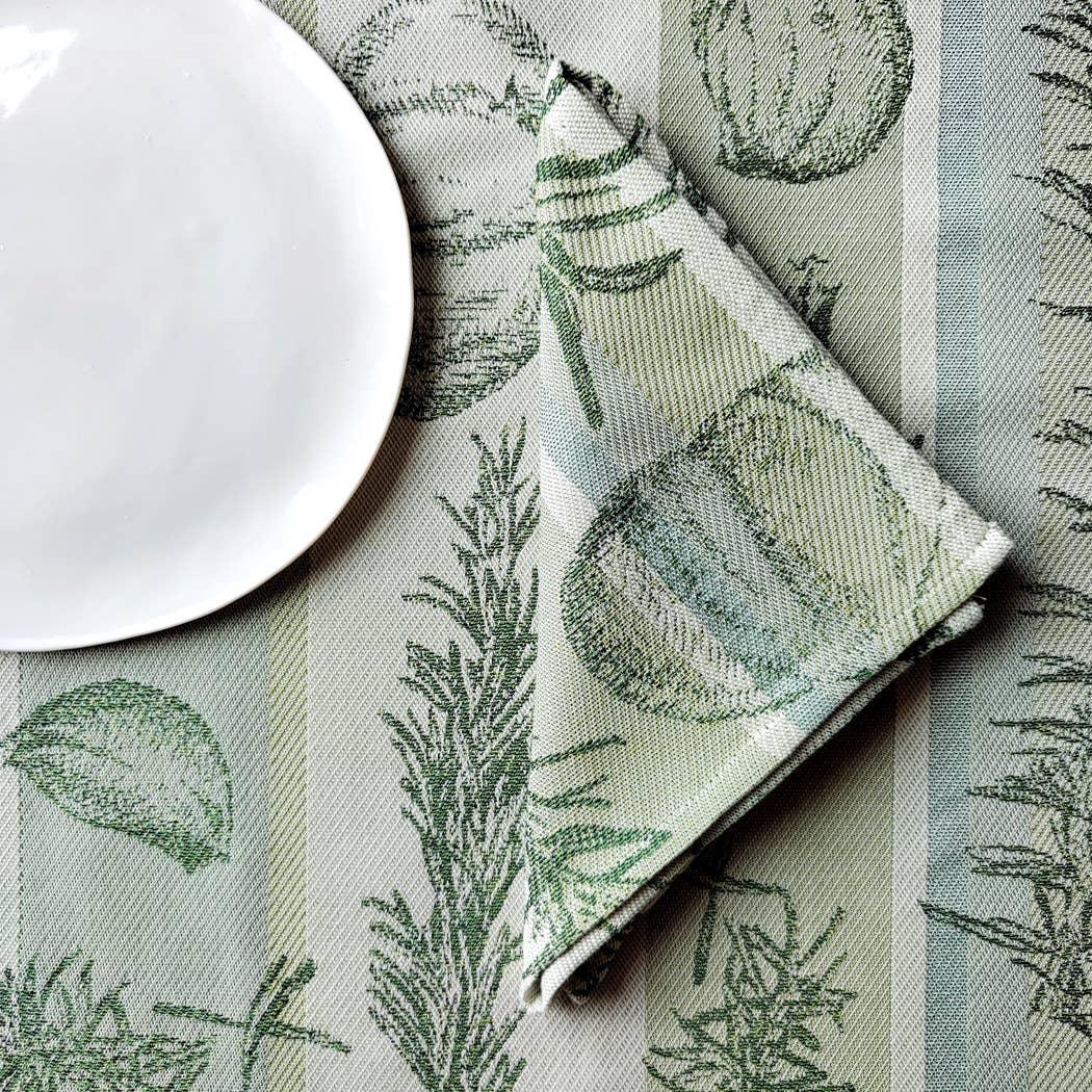 Garnier-Thiebaut green cotton jacquard napkin and tablecloth with botanical pattern