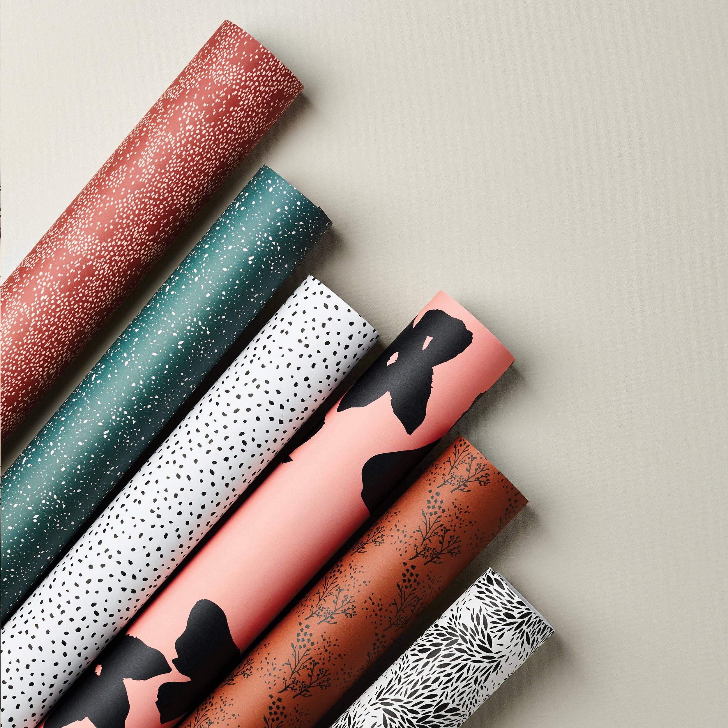 Assorted premium designer wallpaper rolls by Shopify, paper material, multi-coloured prints