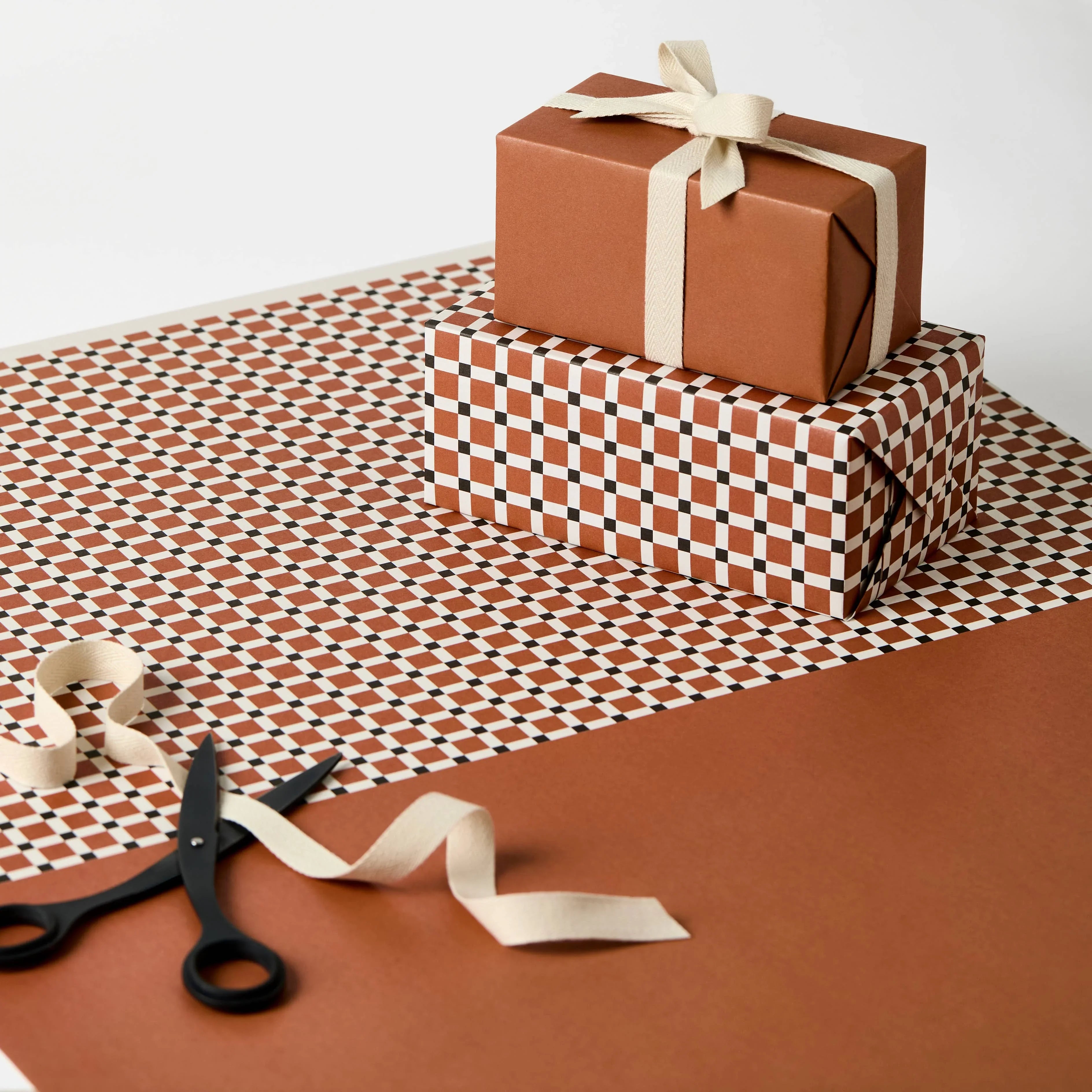 Wrappr premium brown and checkered gift wrap paper, cotton ribbon, and black scissors