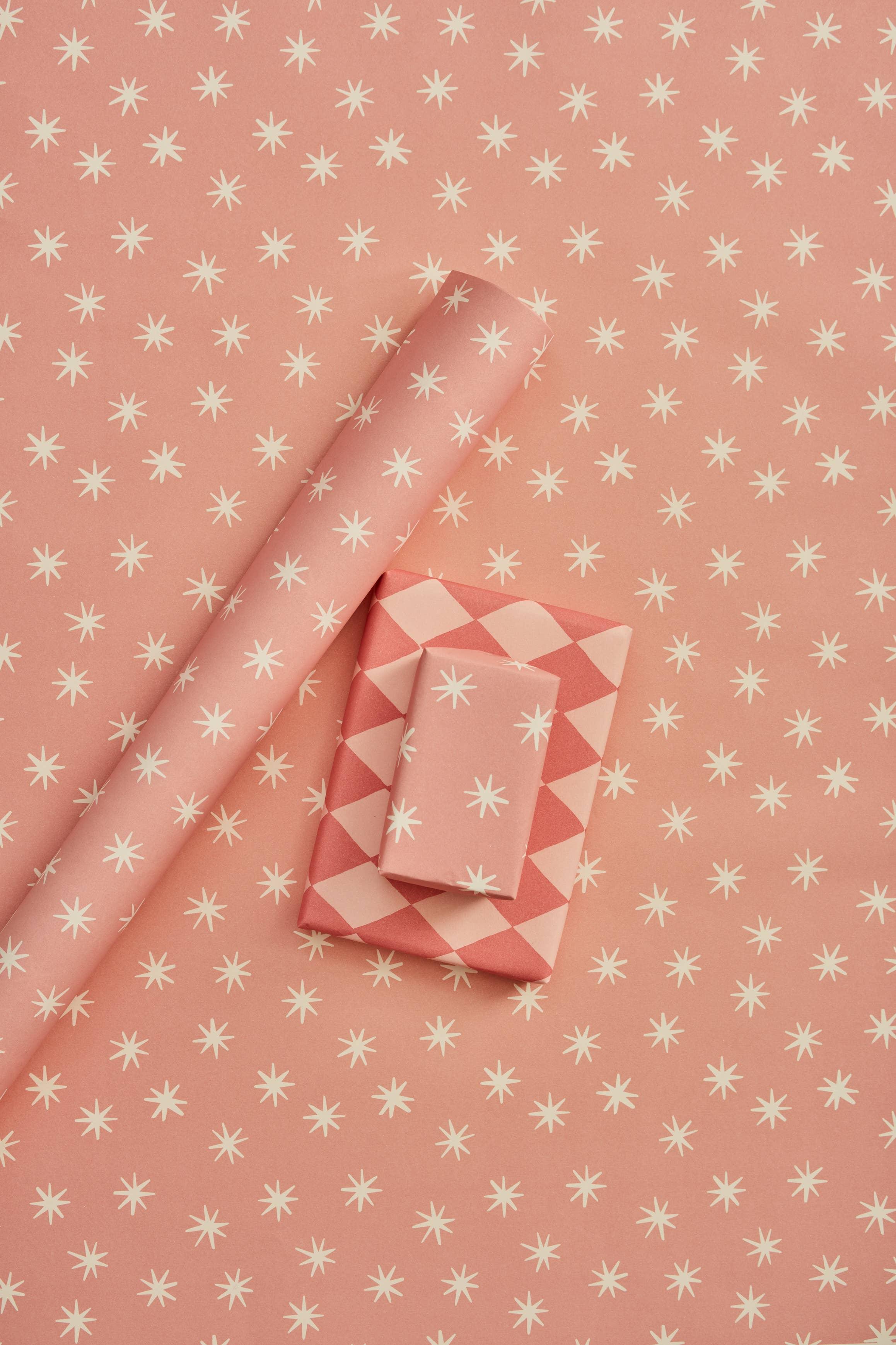 Wrappr premium pink paper gift wrap with white star and diamond patterns, eco-friendly material