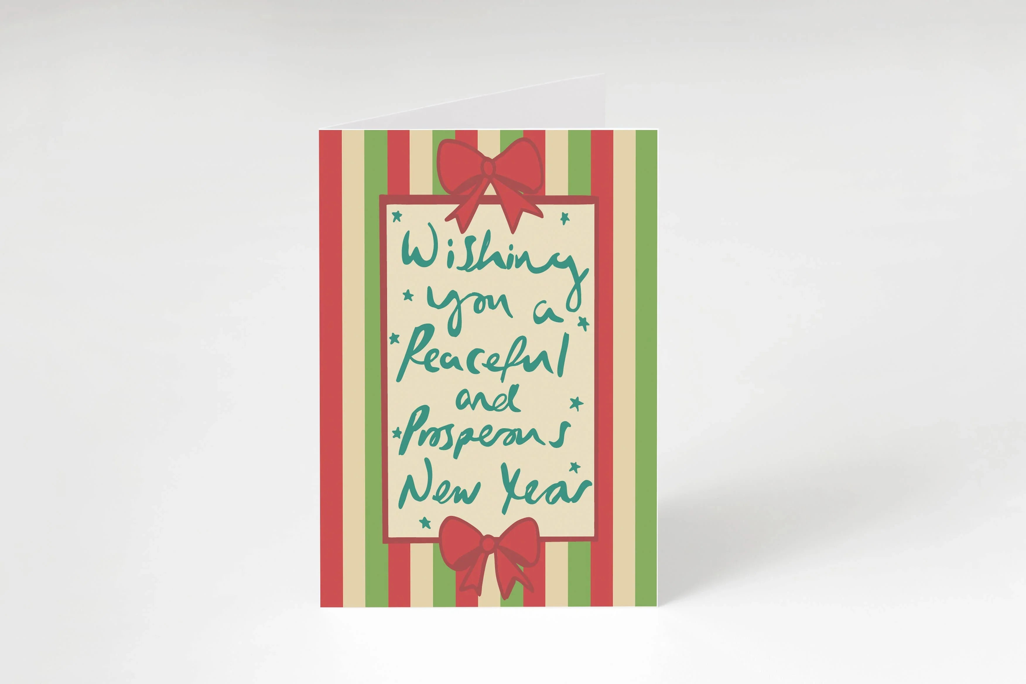 Holiday greeting card with red and green stripes, ribbon bows, and handwritten New Year message