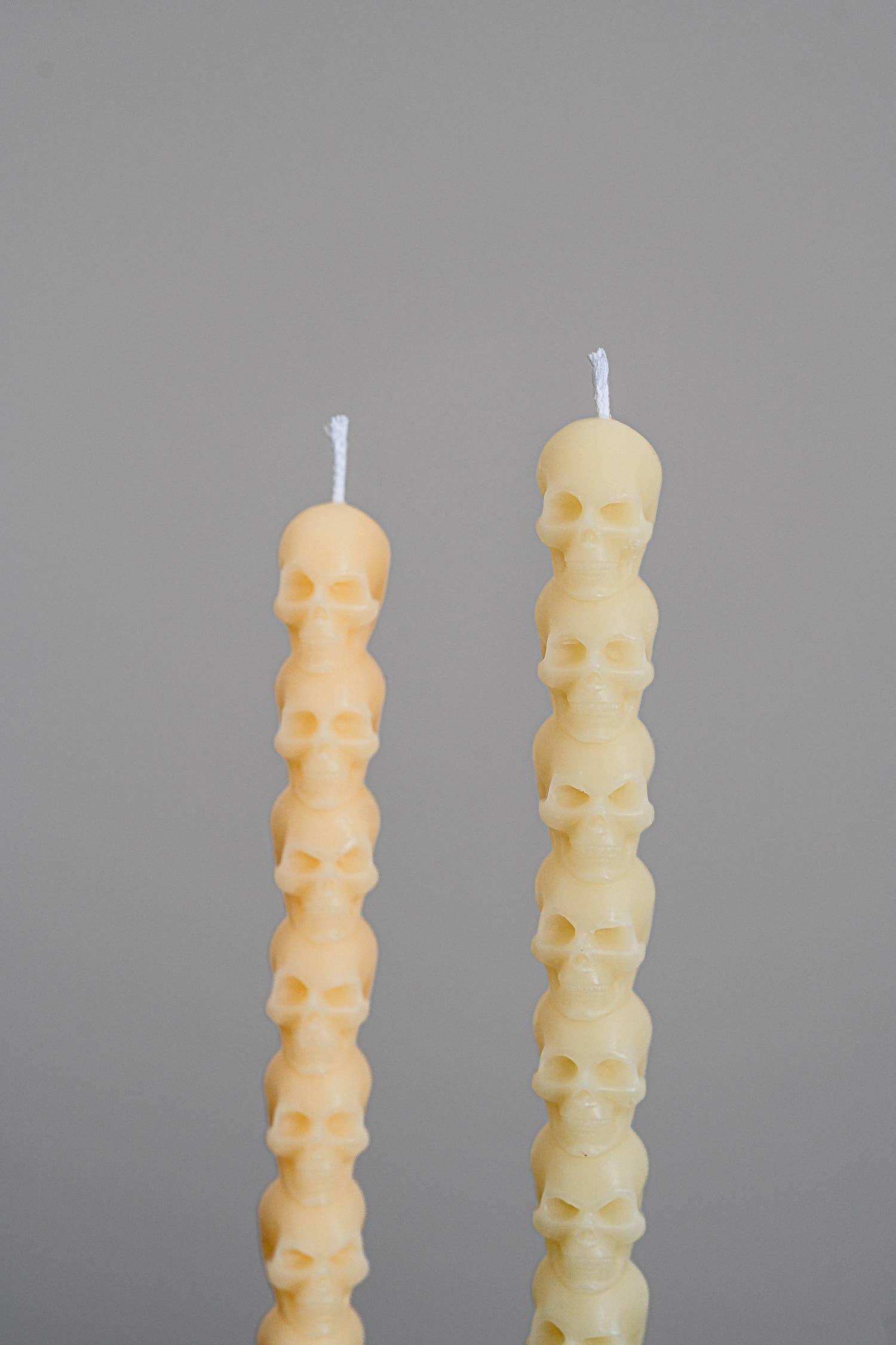 Two Third Drawer beeswax skull taper candles in natural yellow, minimalist background