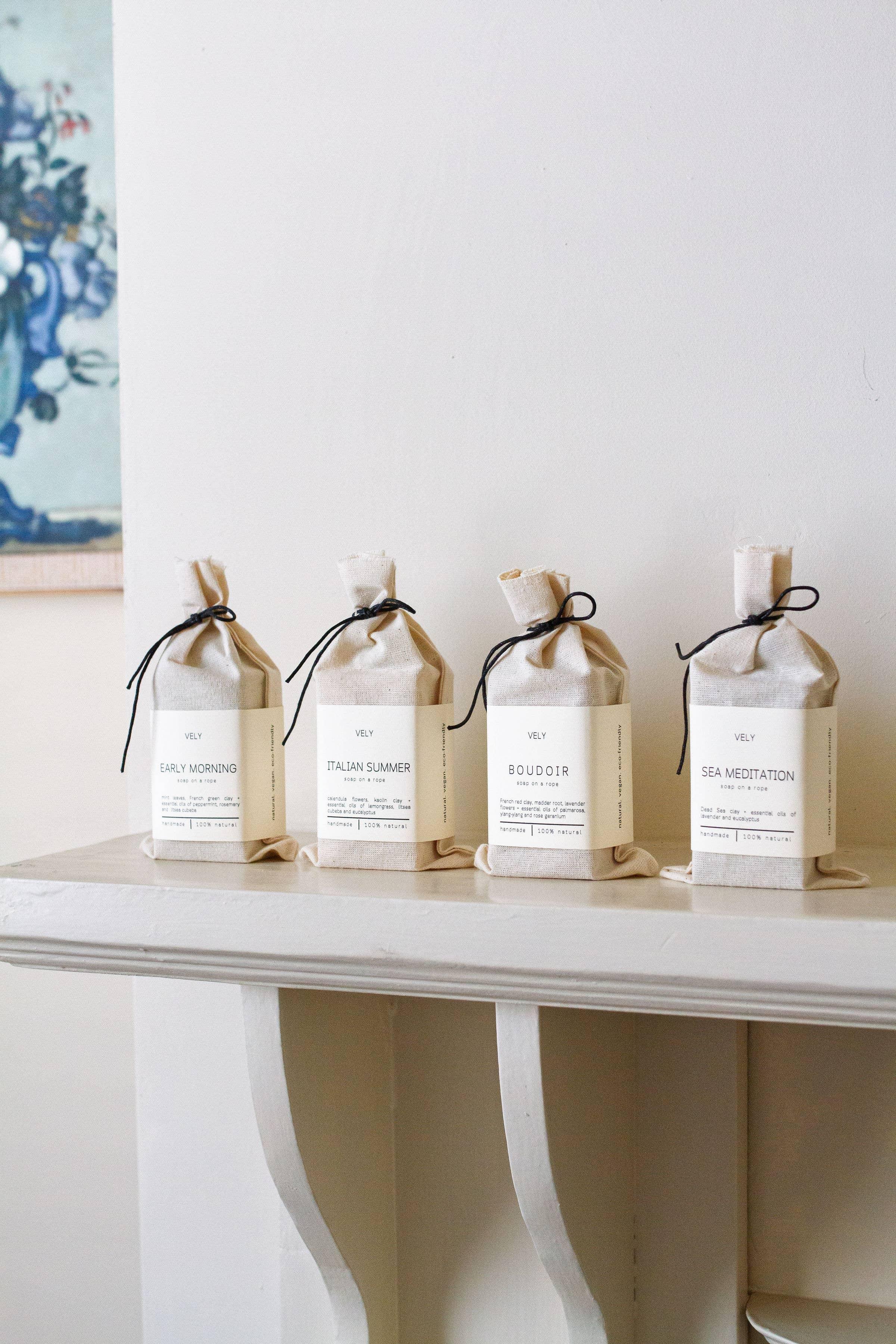 VELY scented sachets in natural cotton bags, minimalist design, displayed on white shelf
