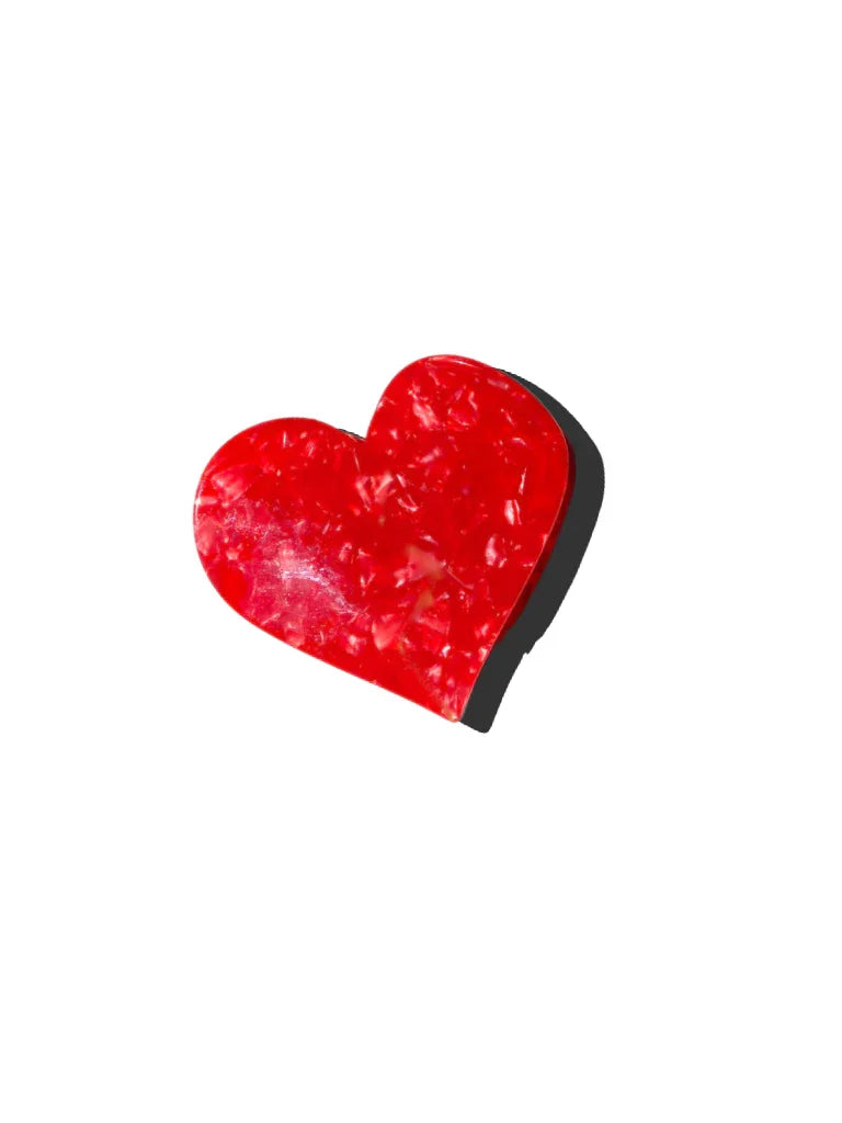 Valet Studio red acrylic heart-shaped hair clip on white background