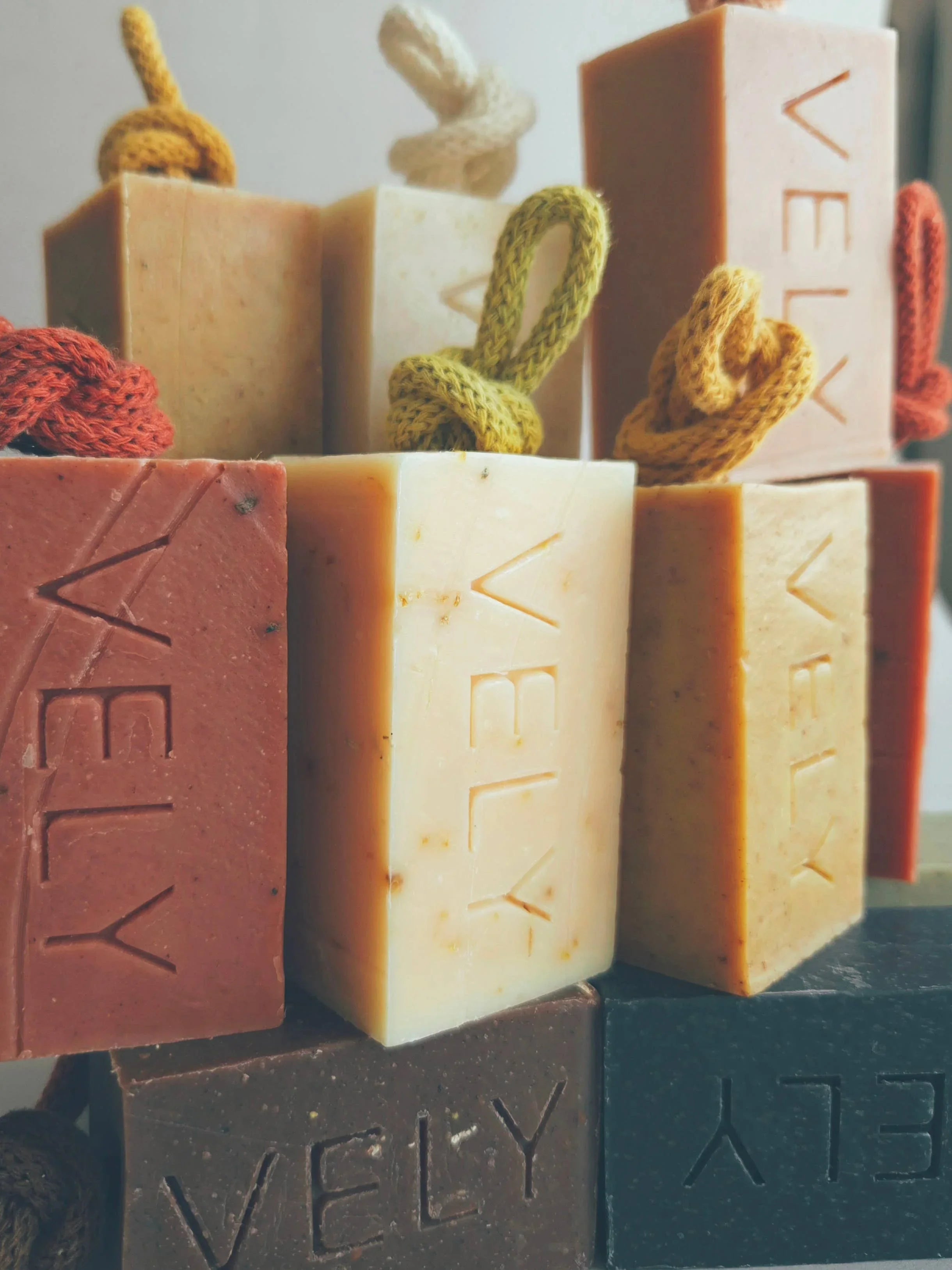VELY natural handmade soap bars in assorted colors with rope handles, premium skincare.