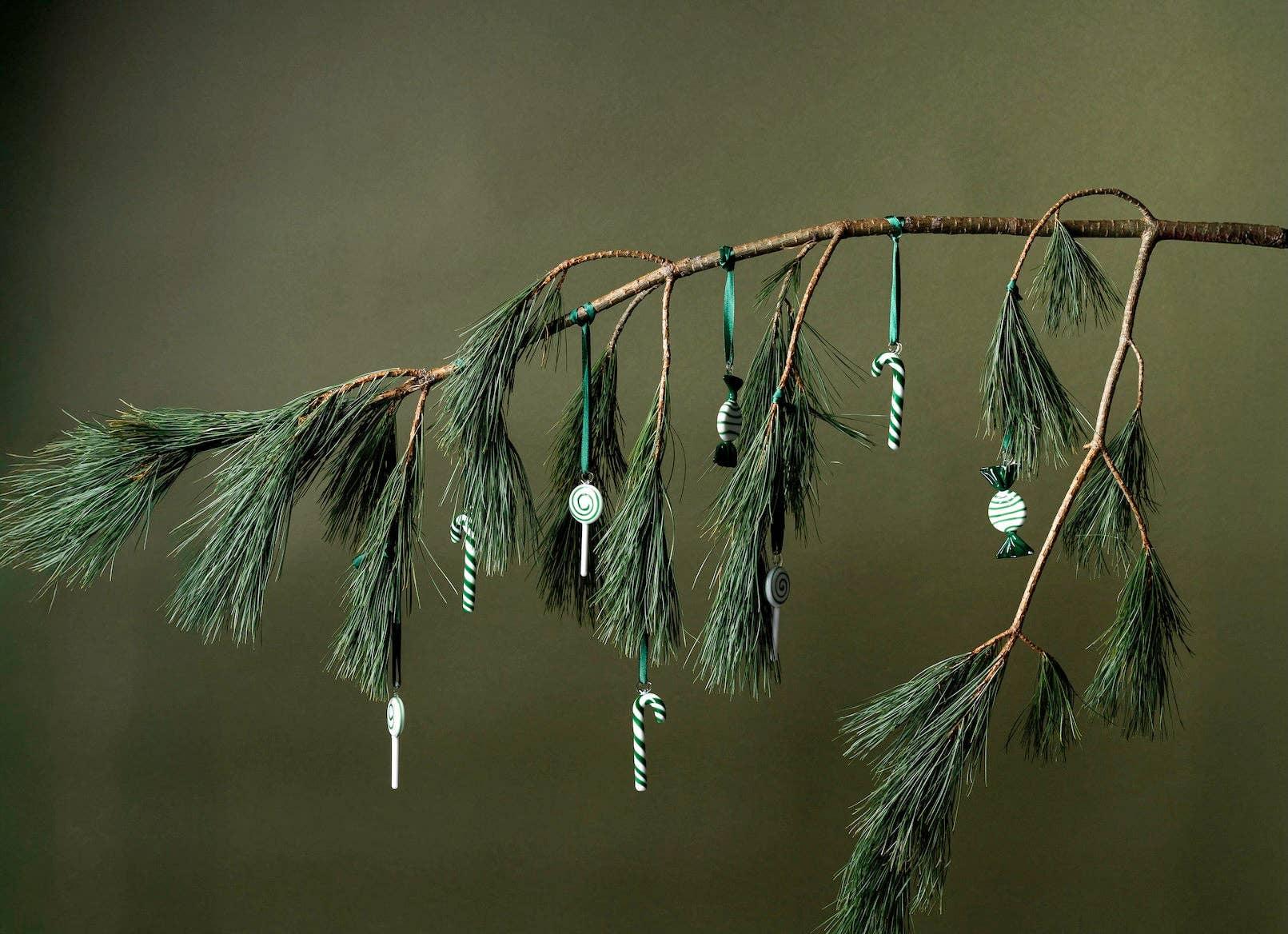 Ferm Living glass candy ornaments in green and white on pine branch