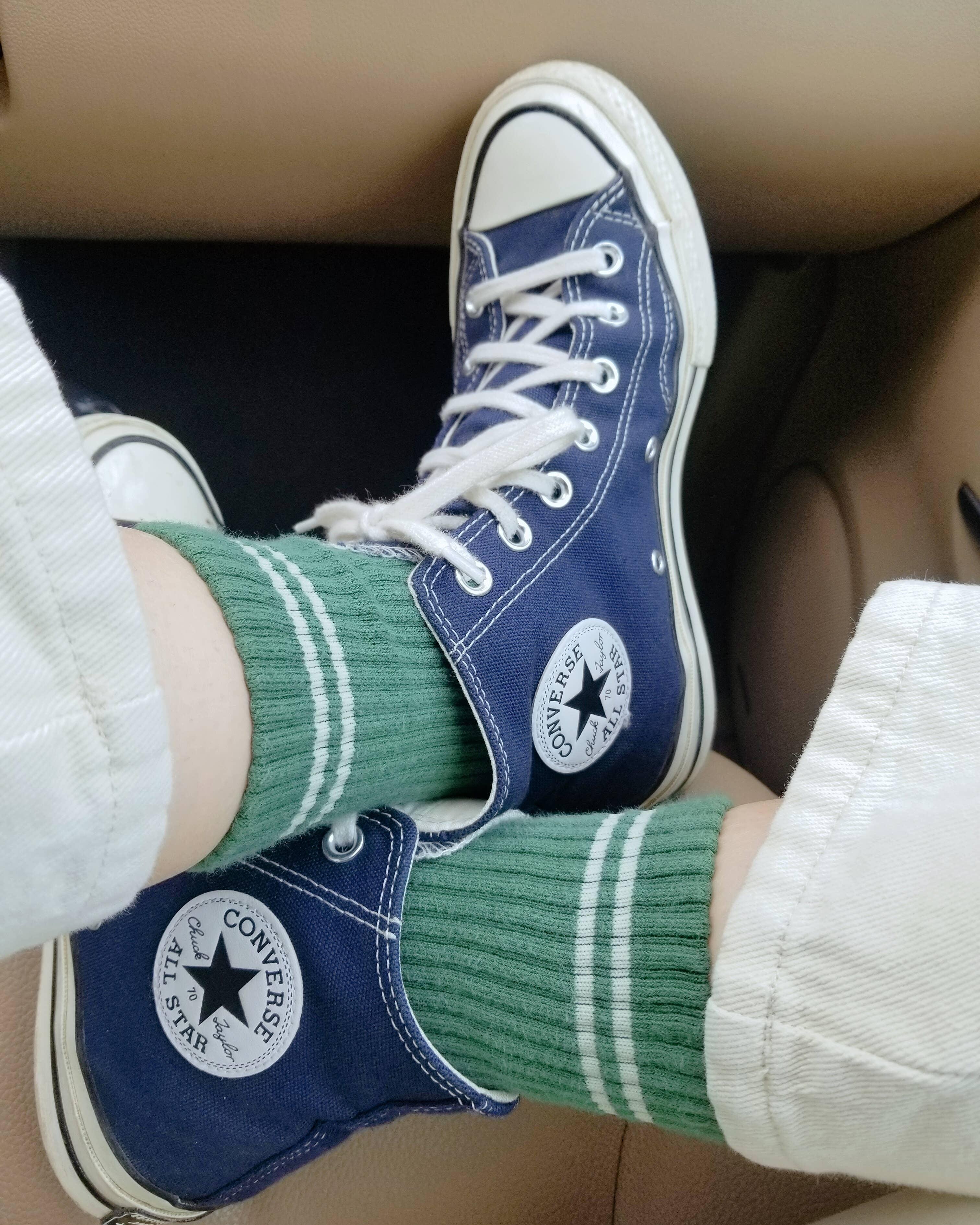 Converse Chuck Taylor All Star blue canvas high-top sneakers with white laces and logo patch