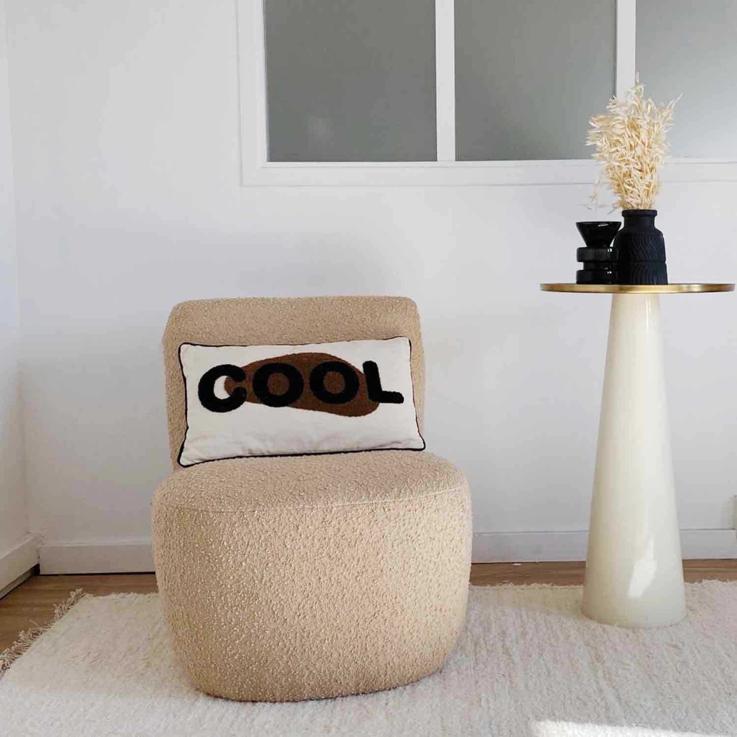 Eve armchair in beige bouclé