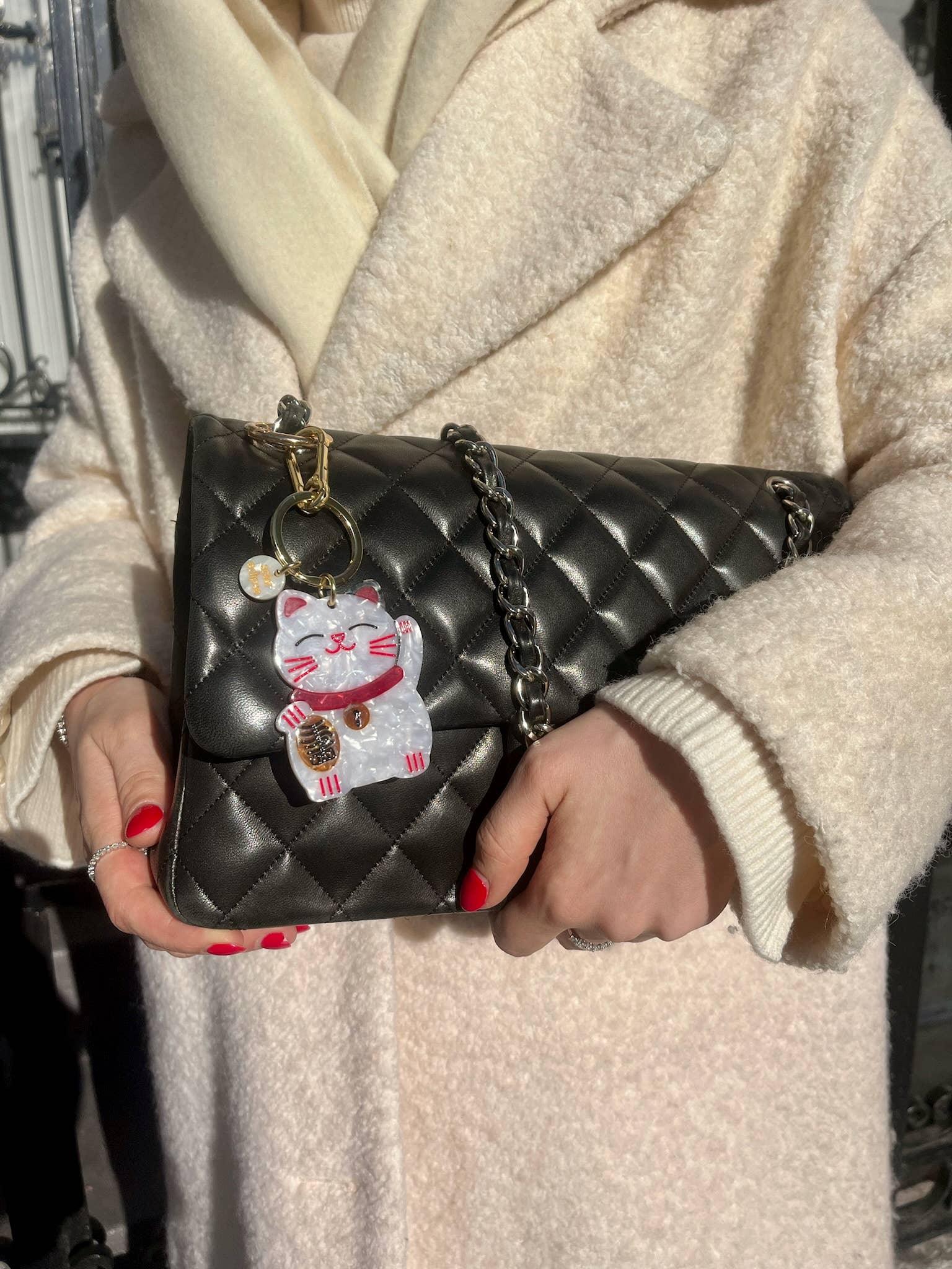 VANESSA MOONEY black quilted leather shoulder bag with chain strap and lucky cat charm