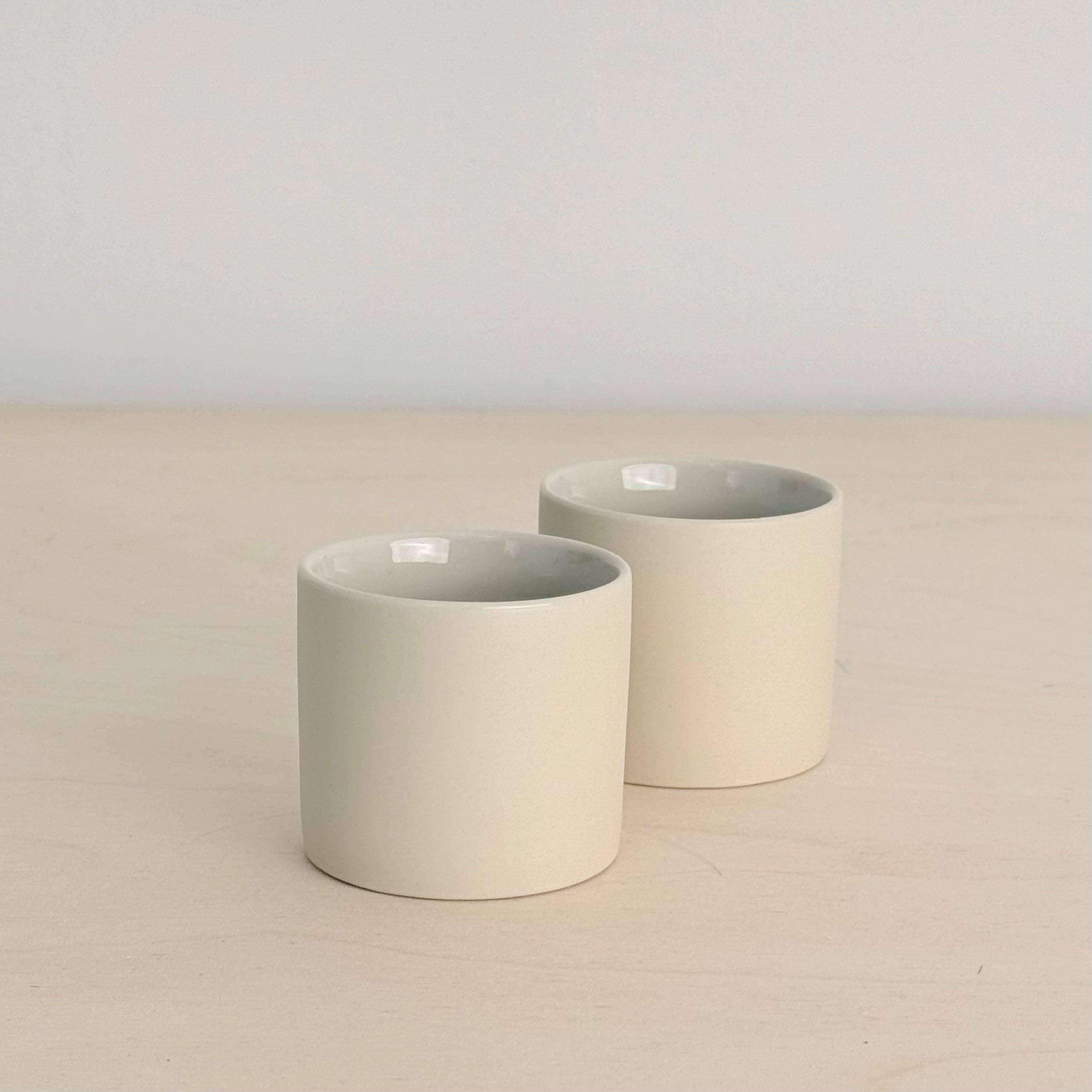 Studio Enti cream ceramic cups, minimalist design, premium porcelain finish