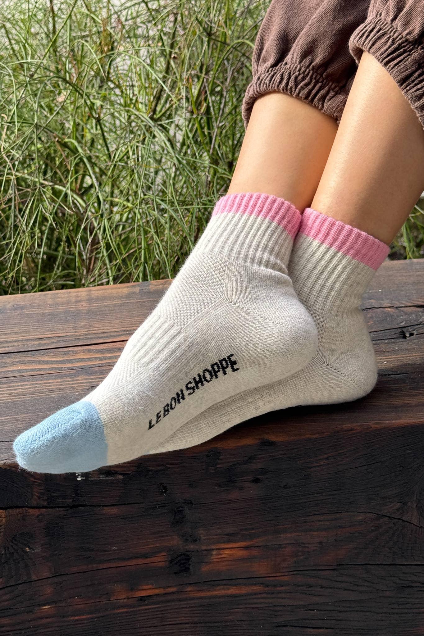 Le Bon Shoppe wool socks in cream with pink cuff and blue toe, worn outdoors
