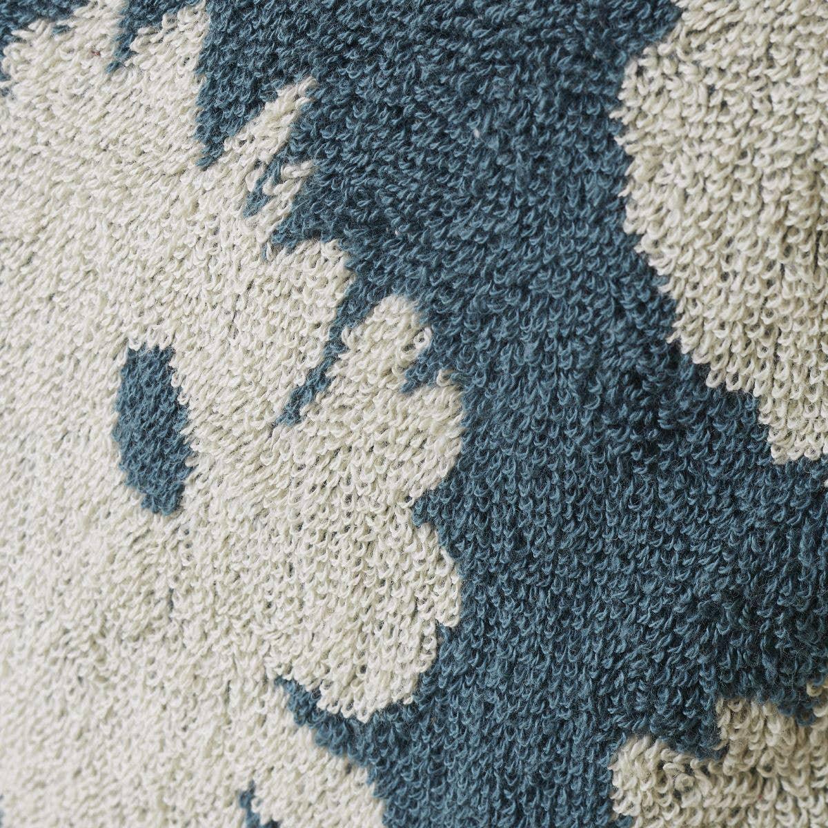 Slowdown Studio textured knit throw blanket, blue and cream floral cotton pattern