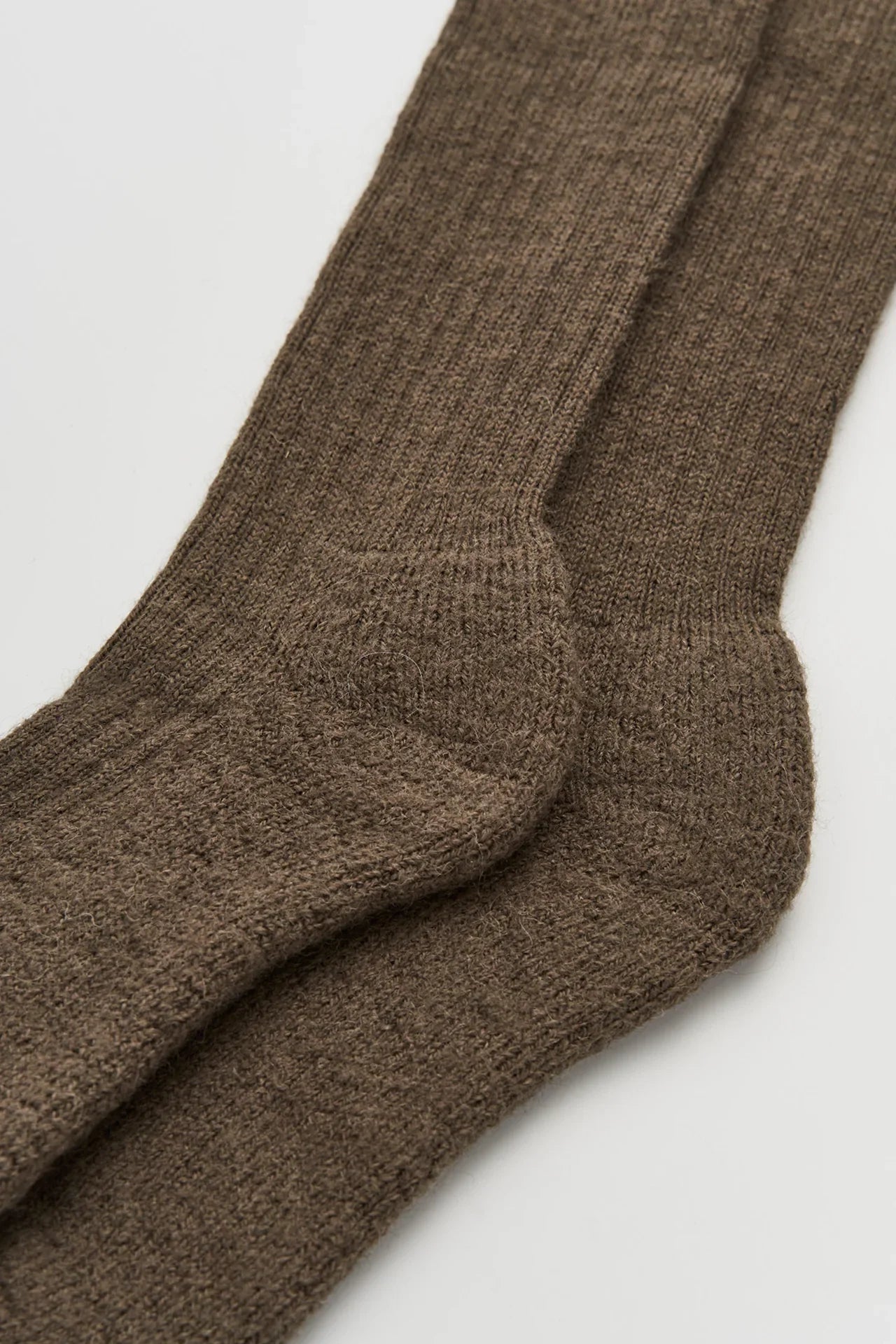 Auralee brown alpaca wool ribbed socks, premium textured knit, close-up view