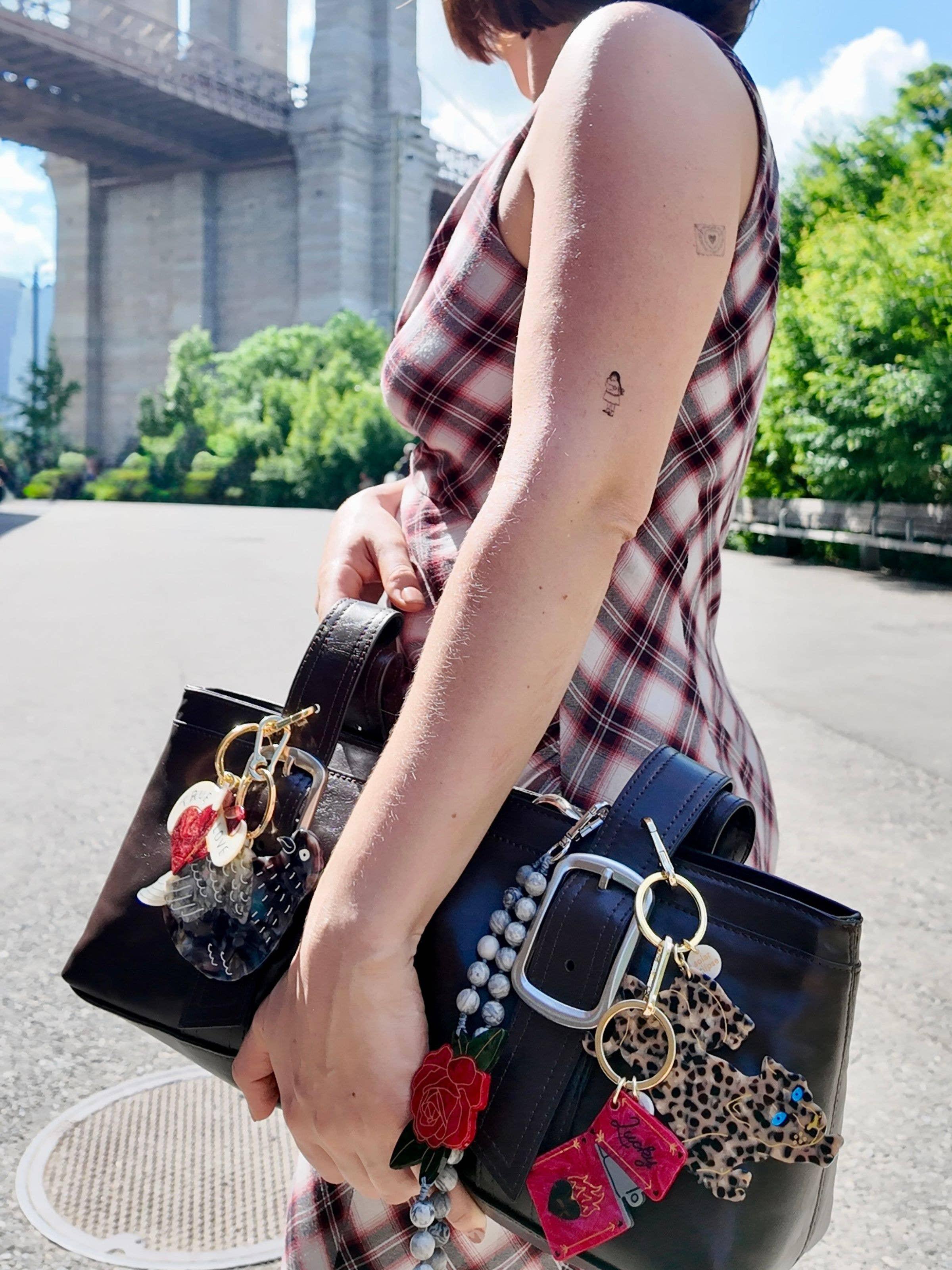 Susan Alexandra black leather handbag with beaded and acrylic charms, street style
