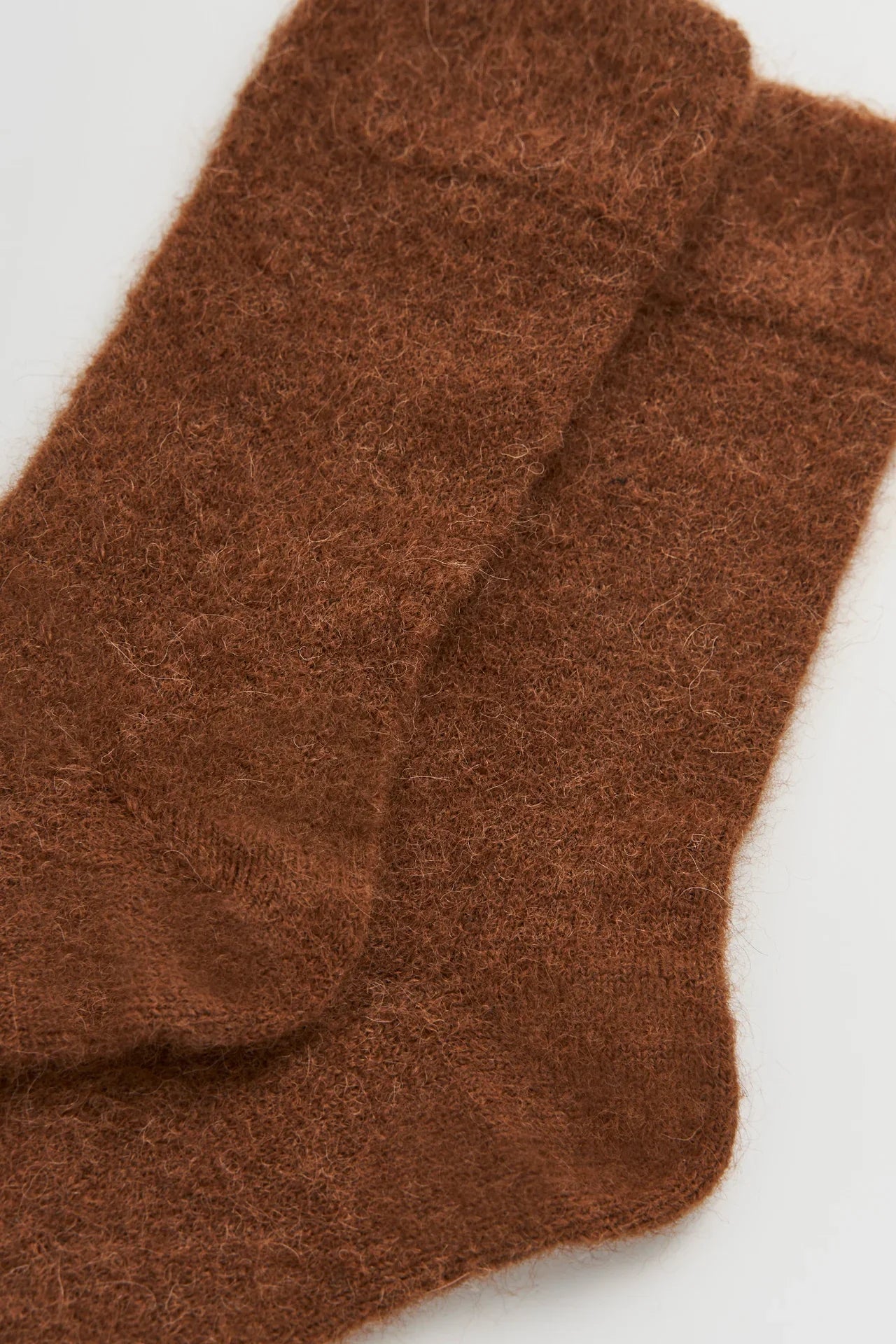 Le Bon Shoppe brown fuzzy alpaca wool socks on white background