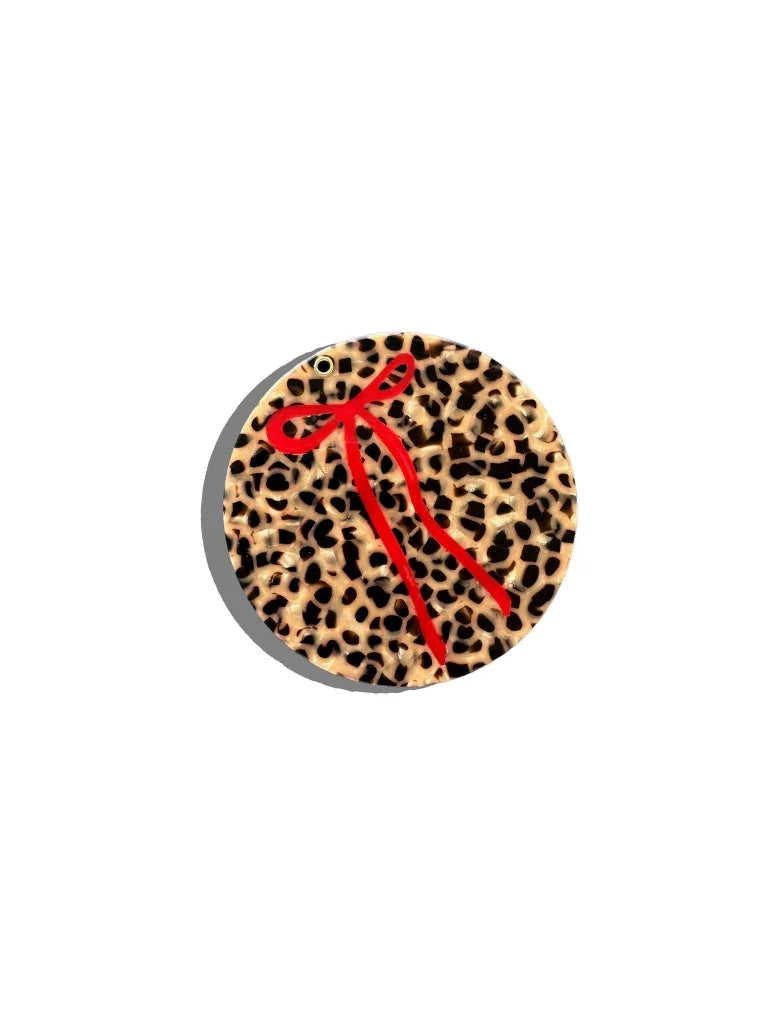 Blaqdaisy leopard print acrylic keychain with red bow accent, premium animal print accessory