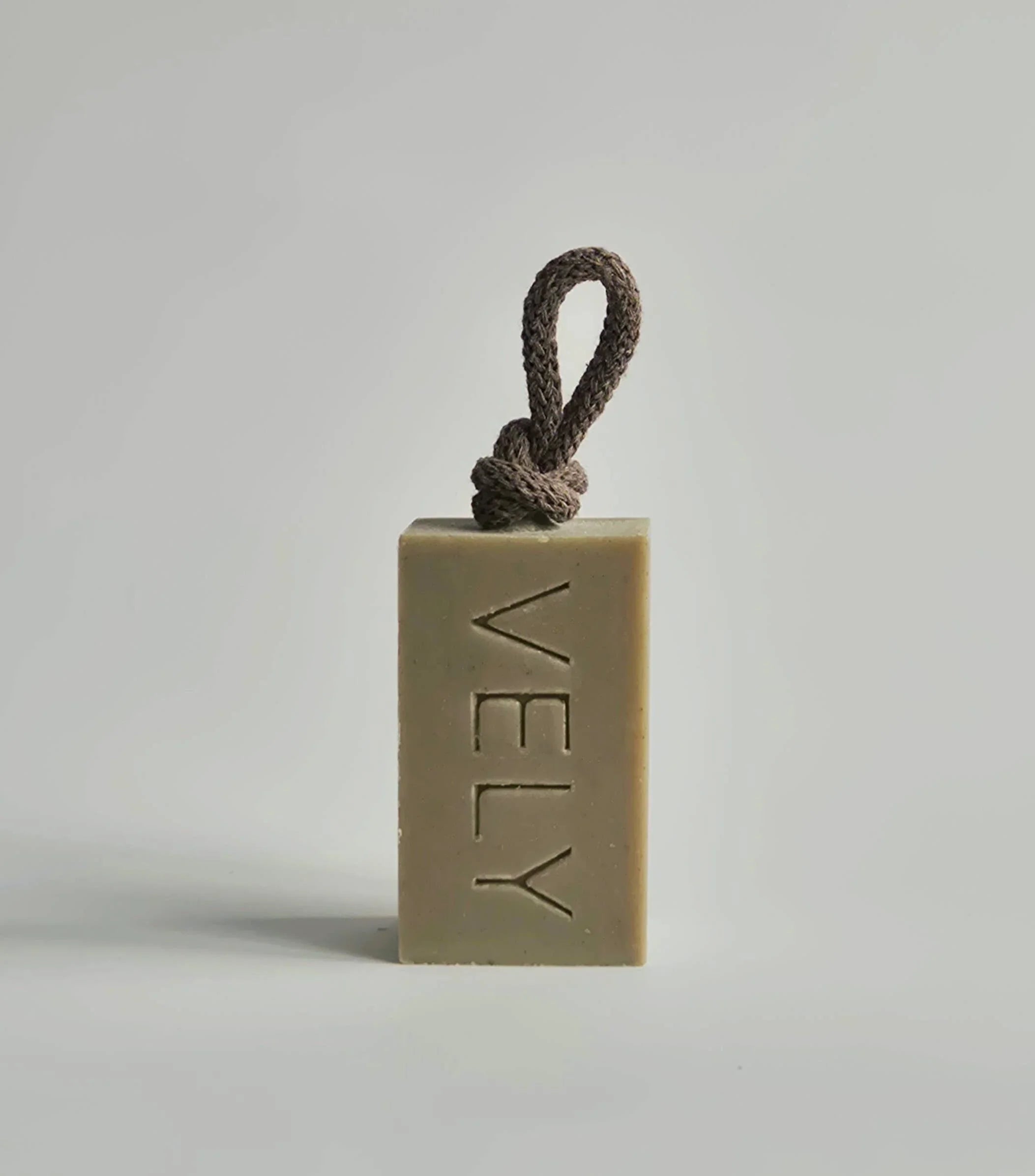 VELY natural beige soap bar with brown rope handle, premium minimalist design.