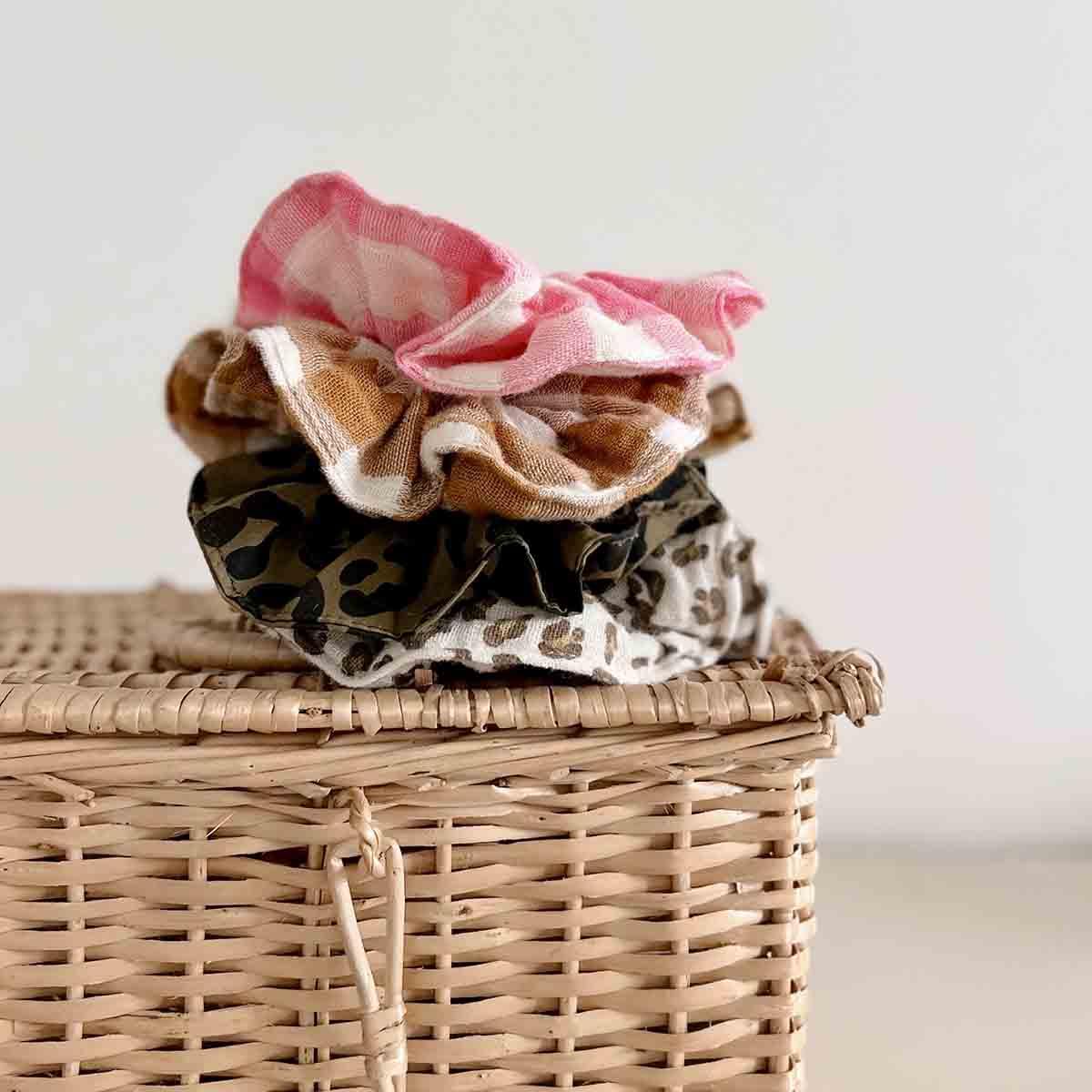 Gather scrunchie set cotton check and leopard prints hair accessories on wicker basket